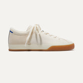 The Lace Up Sneaker in Blonde shown from the side.