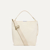 PLP |The Bucket Bag in White Sand shown from the front.