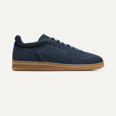The RS01 Sneaker in Navy shown from the side.