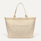 PDP |The Zip Travel Tote in Parchment Basketweave shown from the front.