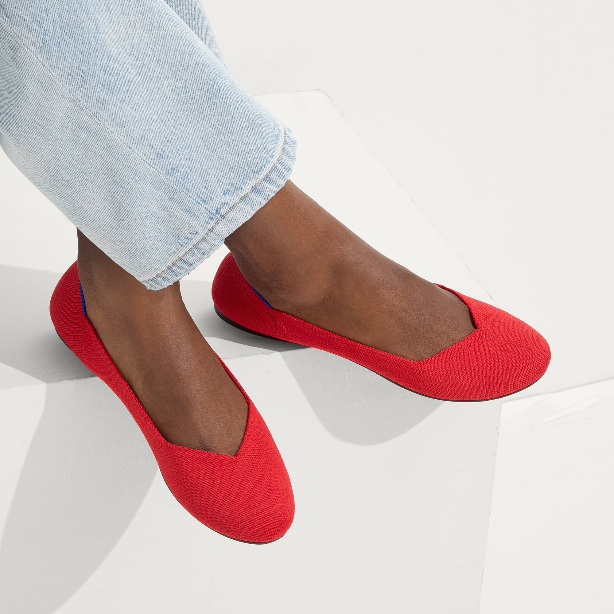hover | Model wearing The Flat in Bright Red.