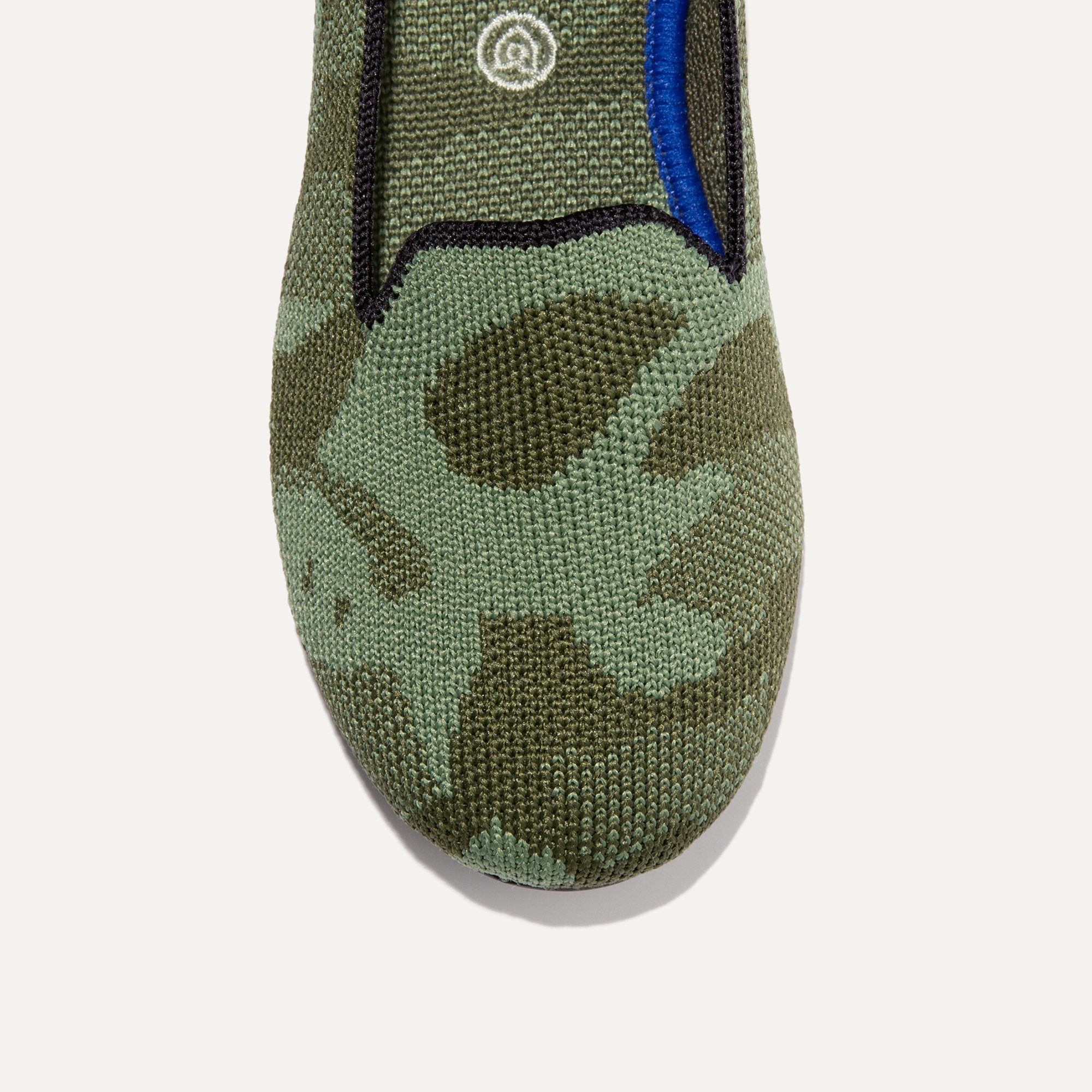 The Kids slip-on Loafer in Olive Camo shown from the top view with detailing of the front of the shoe.