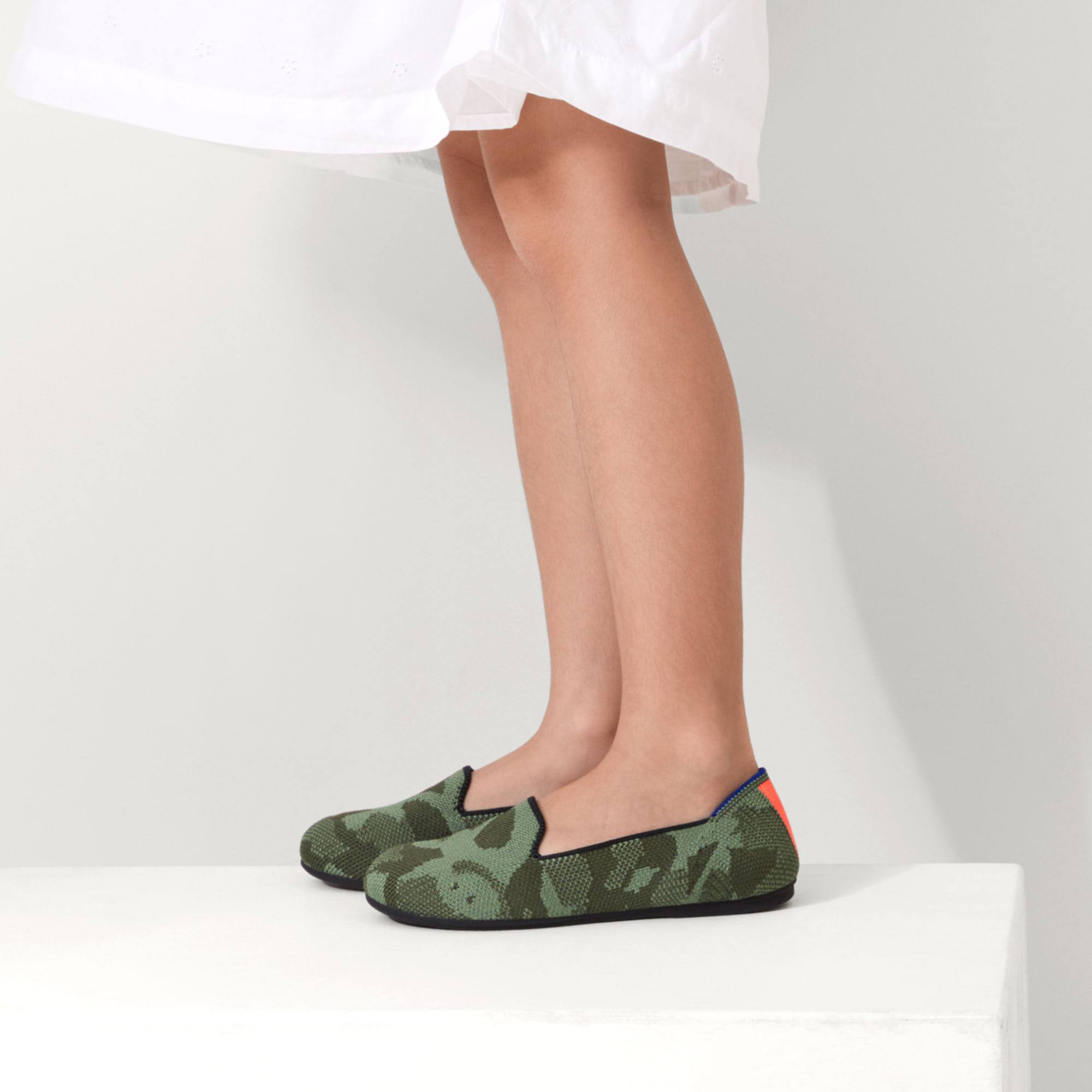 hover | The Kids slip-on Loafer in Olive Camo shown on-model at an angle.