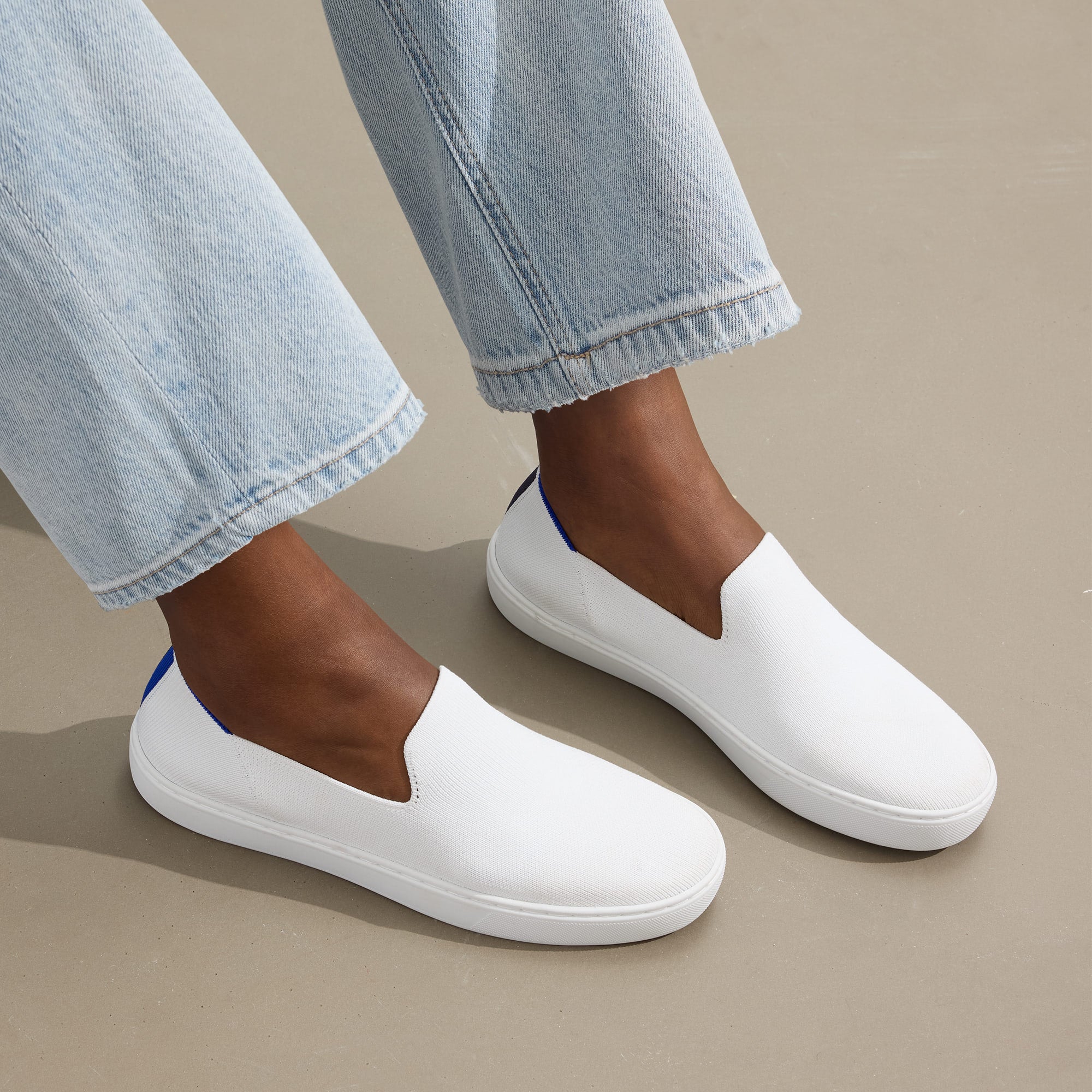 hover | The Original Slip On Sneaker in Bright White shown on-model at an angle.