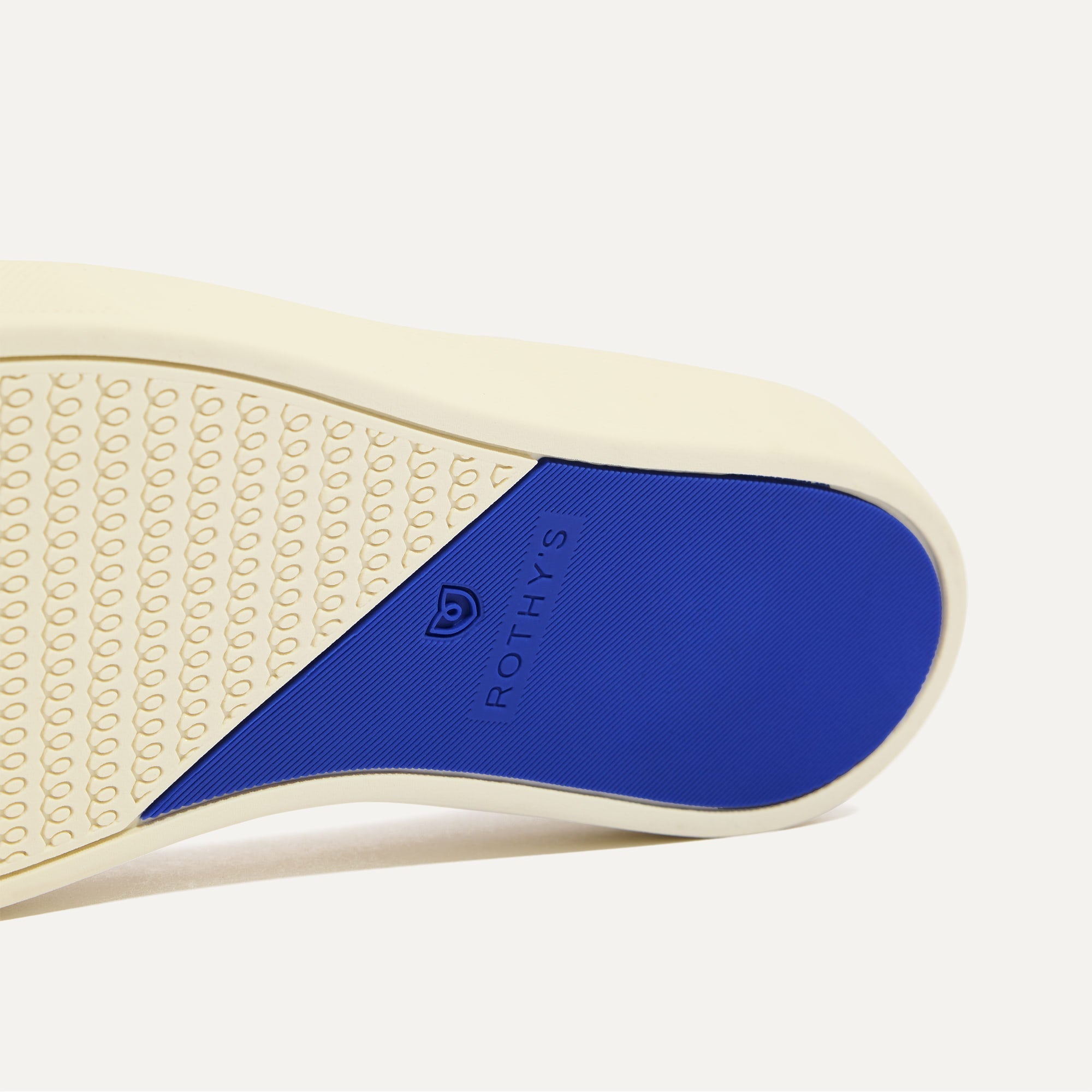 The sole of The Original Slip On Sneaker in Volley shown in diagonal view.