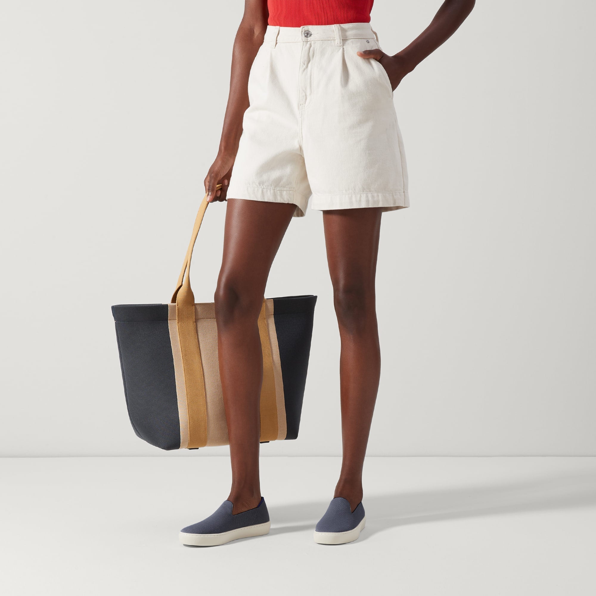 Alternate view of a model wearing The Sneaker in Navy.