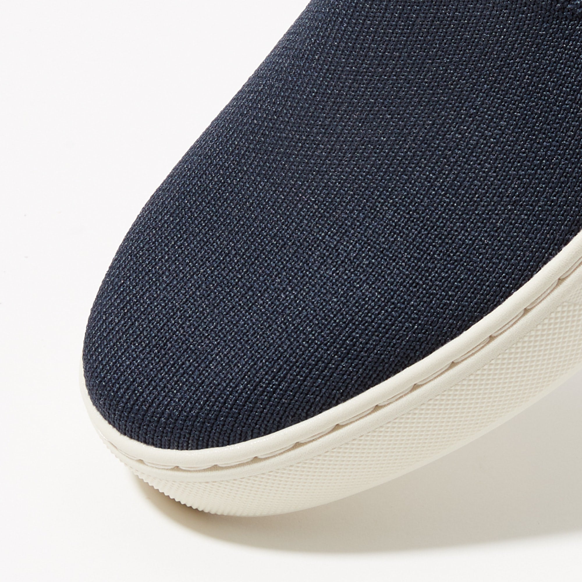 Close up of the toe and vamp of The Sneaker in Navy.