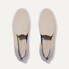 A pair of The slip-on Sneaker in Sand shown from the top view.