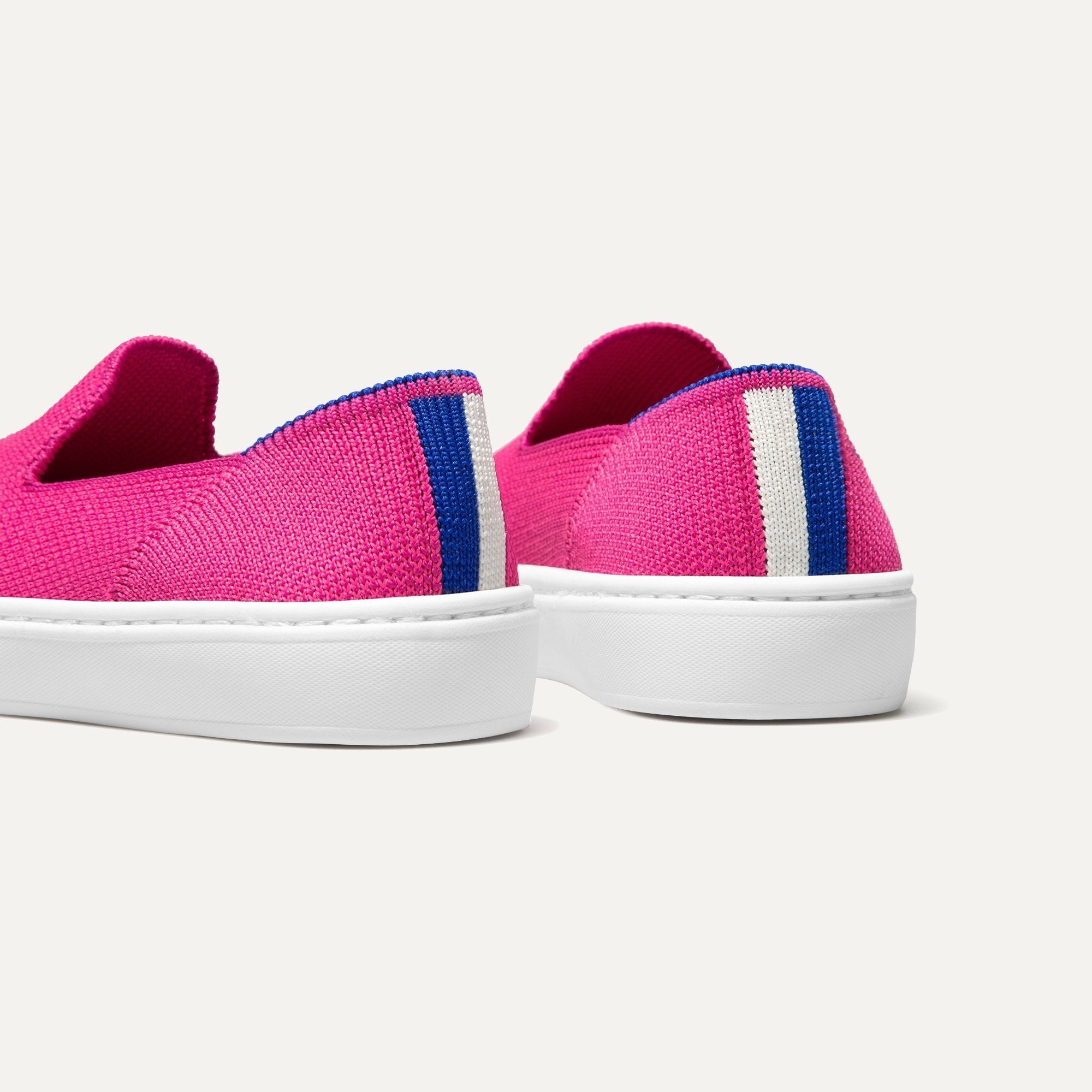 The Kids slip-on Sneaker in Bubblegum shown from the back view with the heel detail.