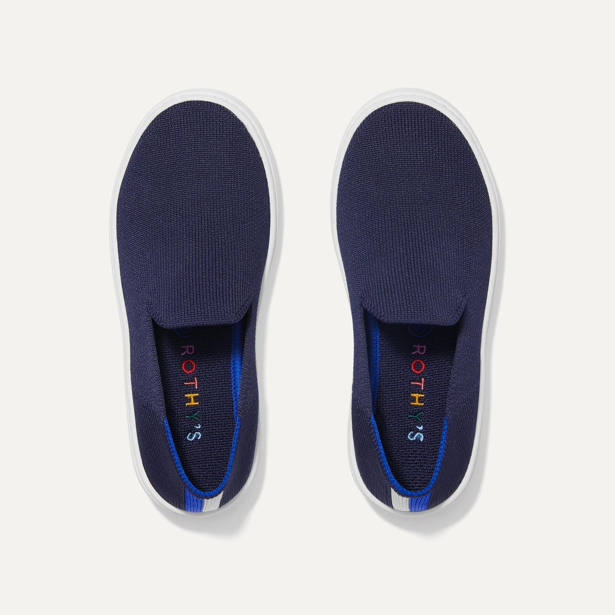 A pair of The Kids slip-on Sneakers in Deep Navy shown from the top view.