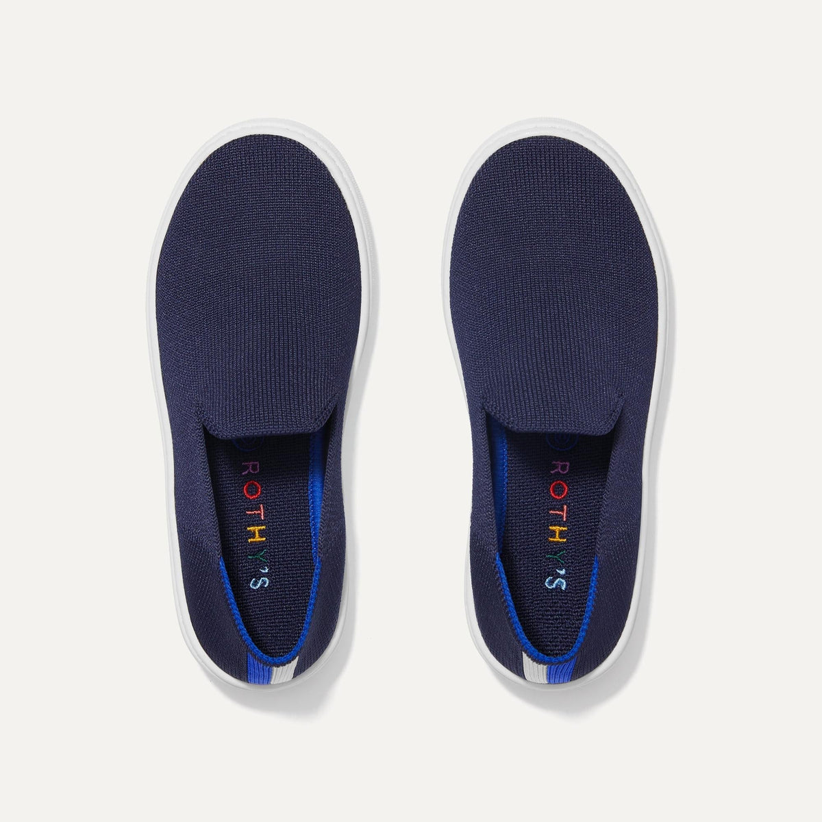 A pair of The Kids slip-on Sneakers in Deep Navy shown from the top view.