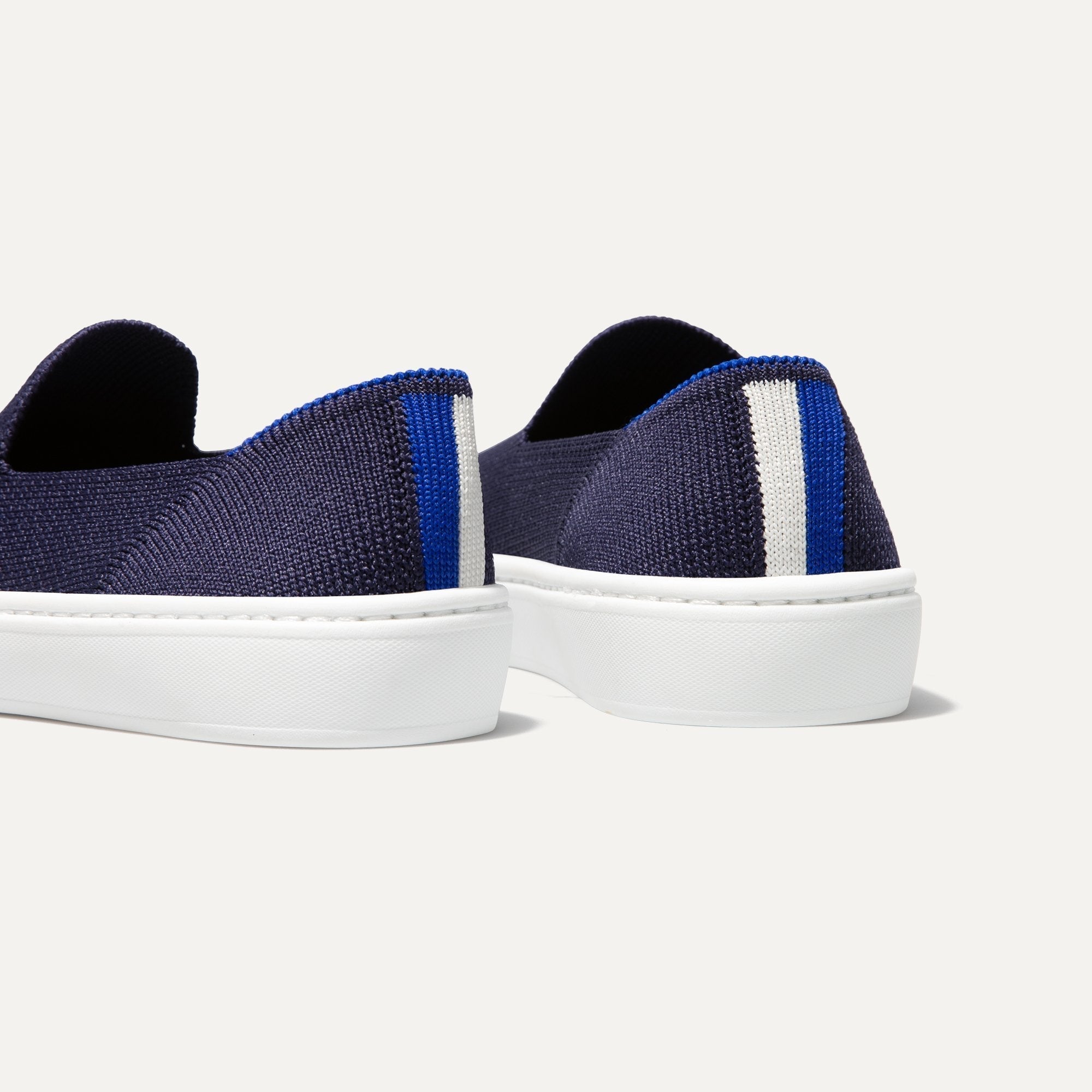 The Kids slip-on Sneaker in Deep Navy shown from the back view with the heel detail.