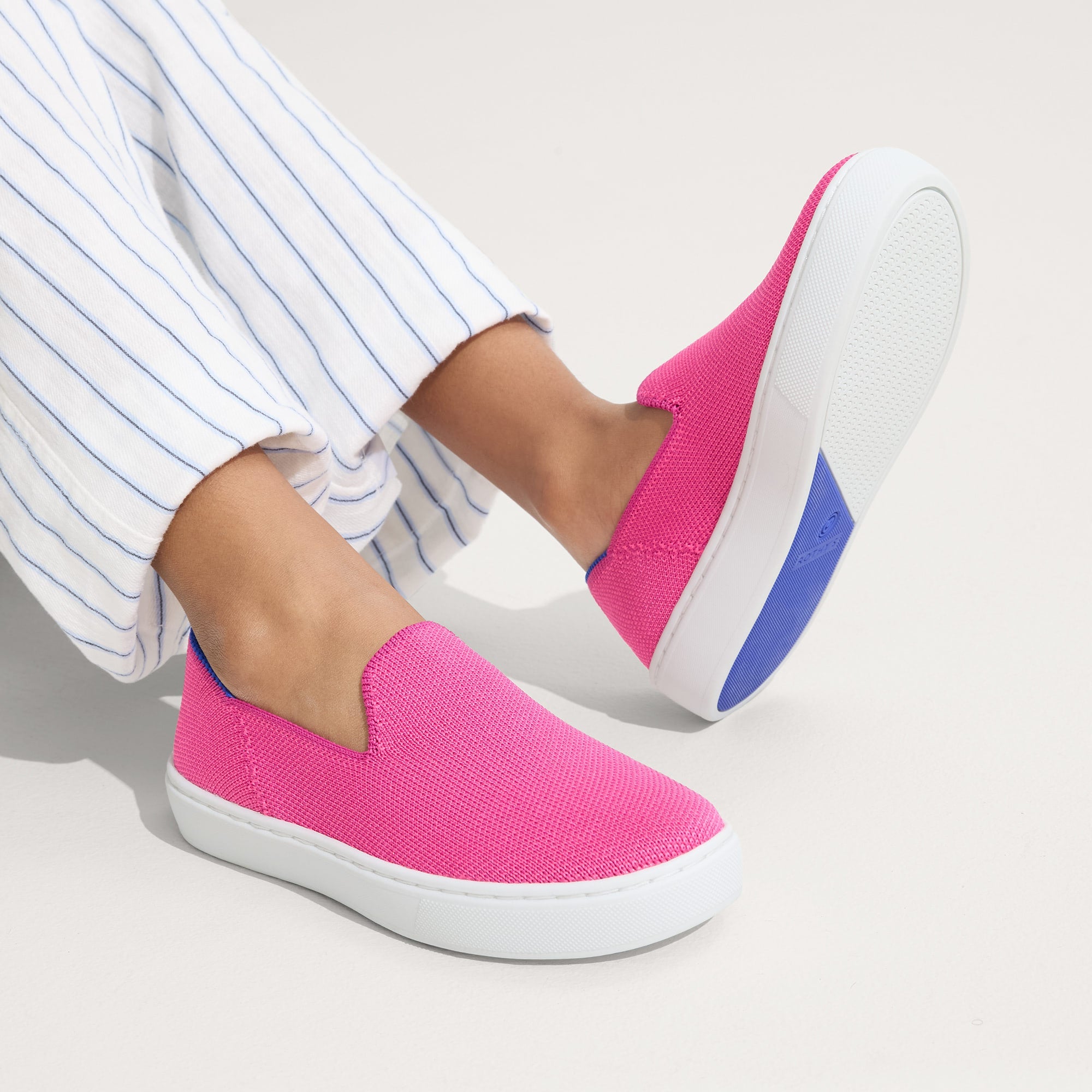 hover | Model wearing The Kids Sneaker in Bubblegum.