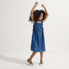 Alternate view of a model wearing The Kids Sneaker in Desert Cat.