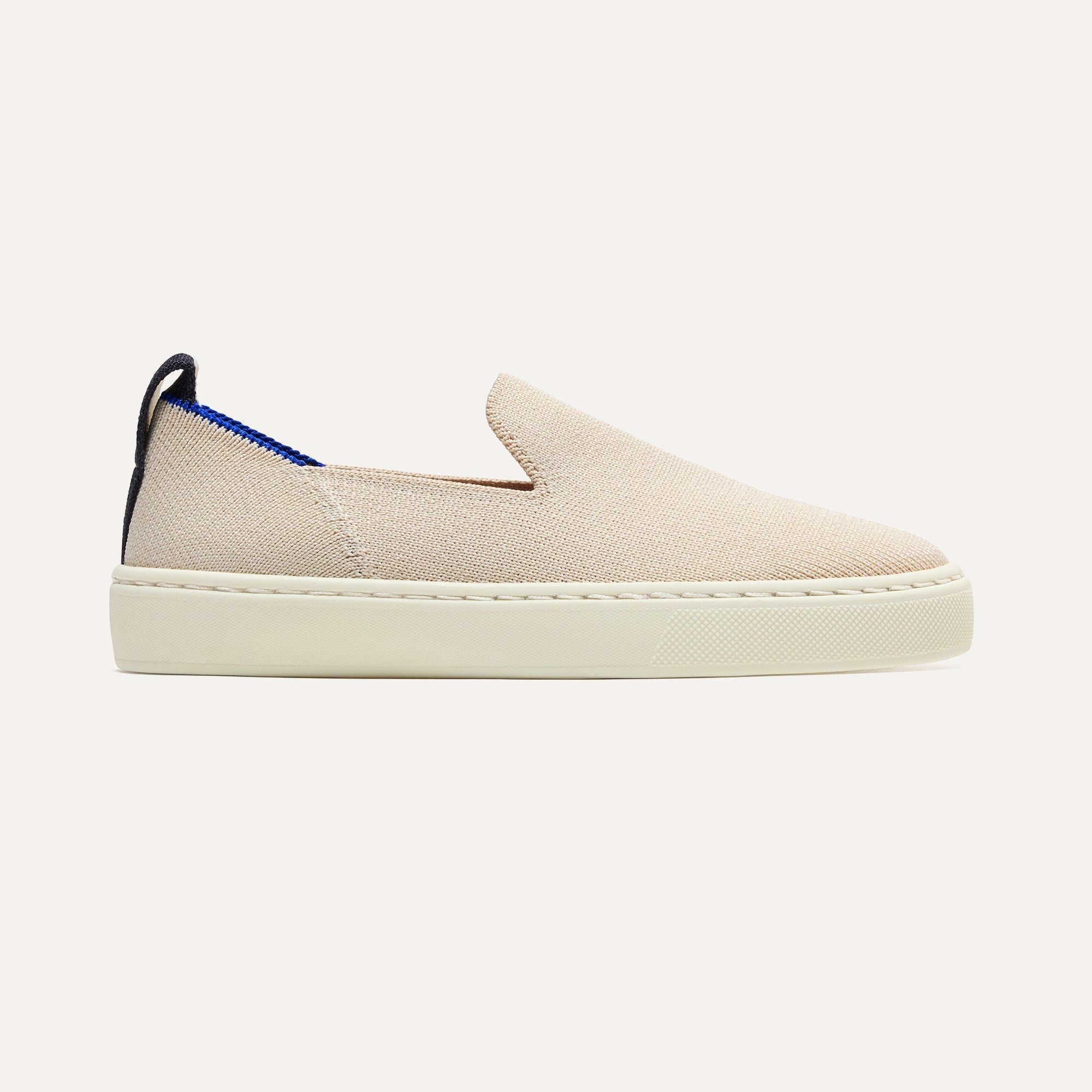 The Kids Sneaker in Sand shown from the side.