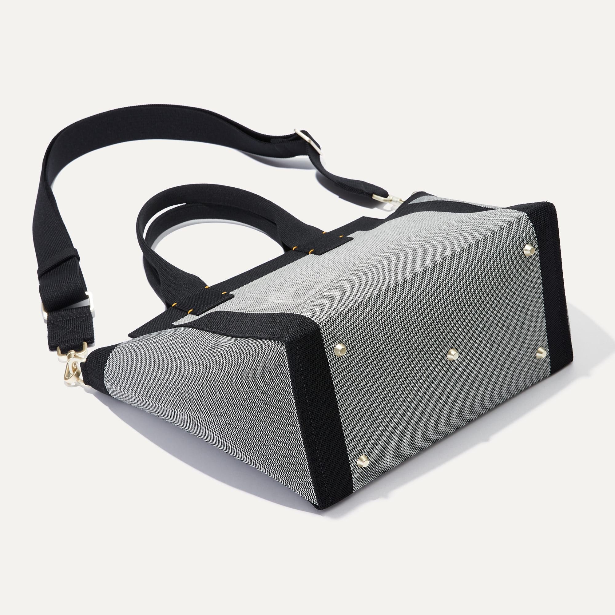 The Handbag in Grey Mist shown from the back.