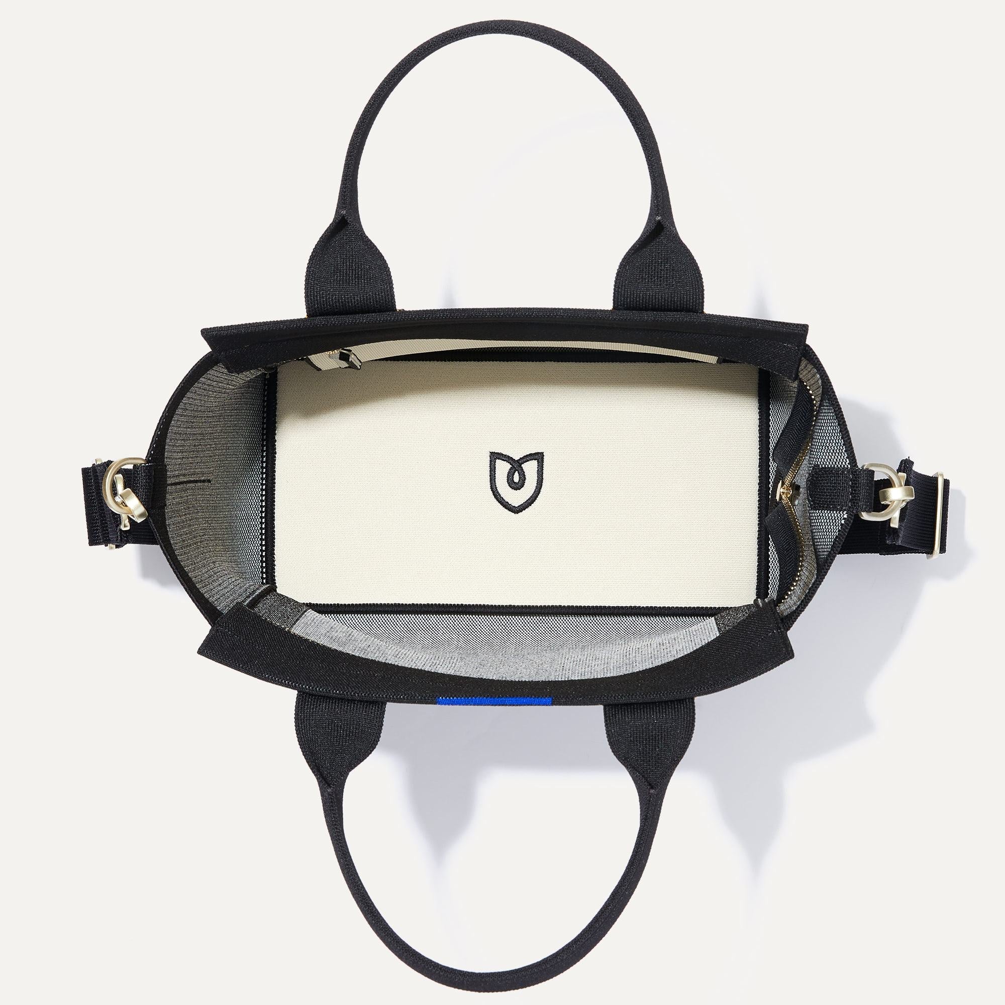 The Handbag in Grey Mist shown laid down.