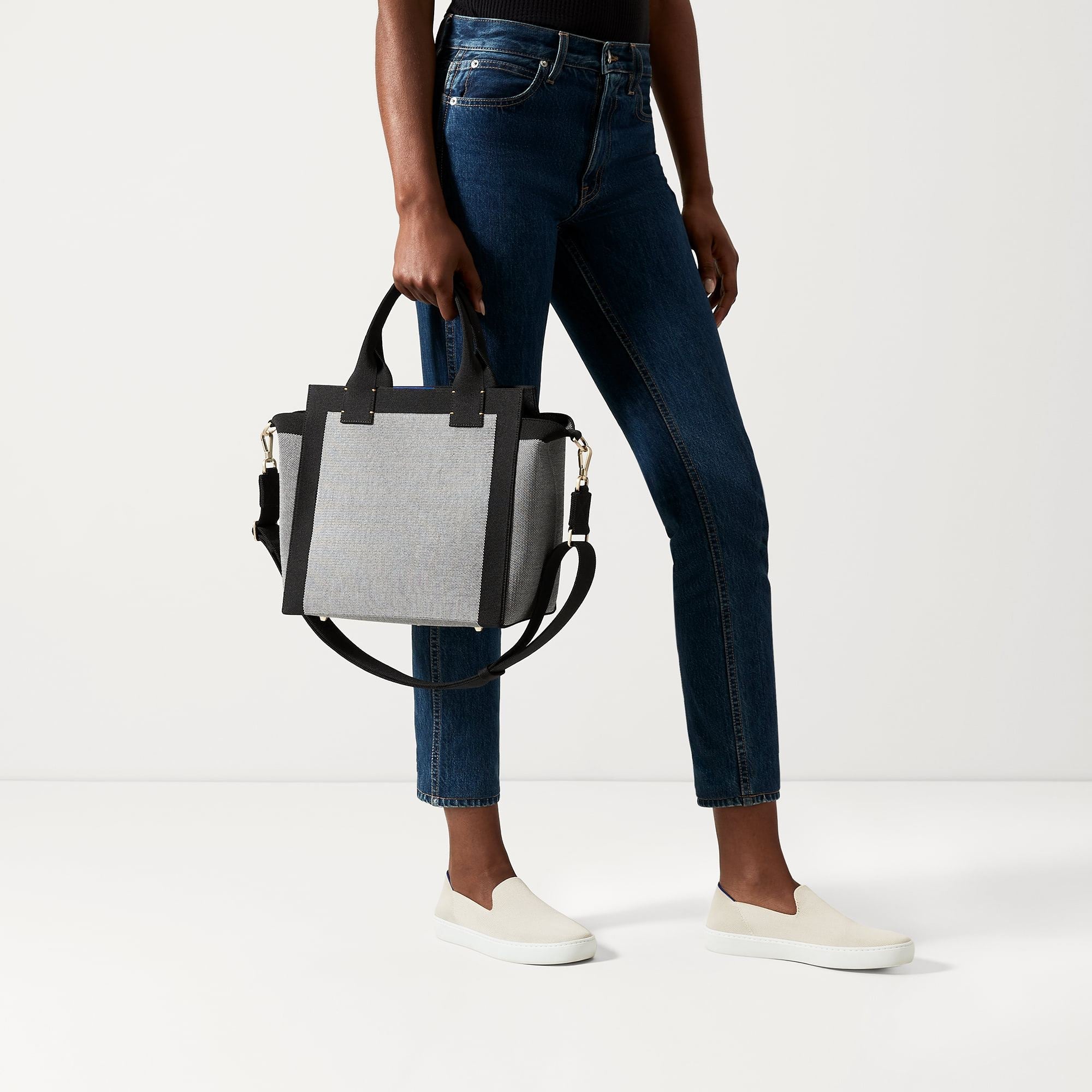 The Handbag in Grey Mist shown on model.