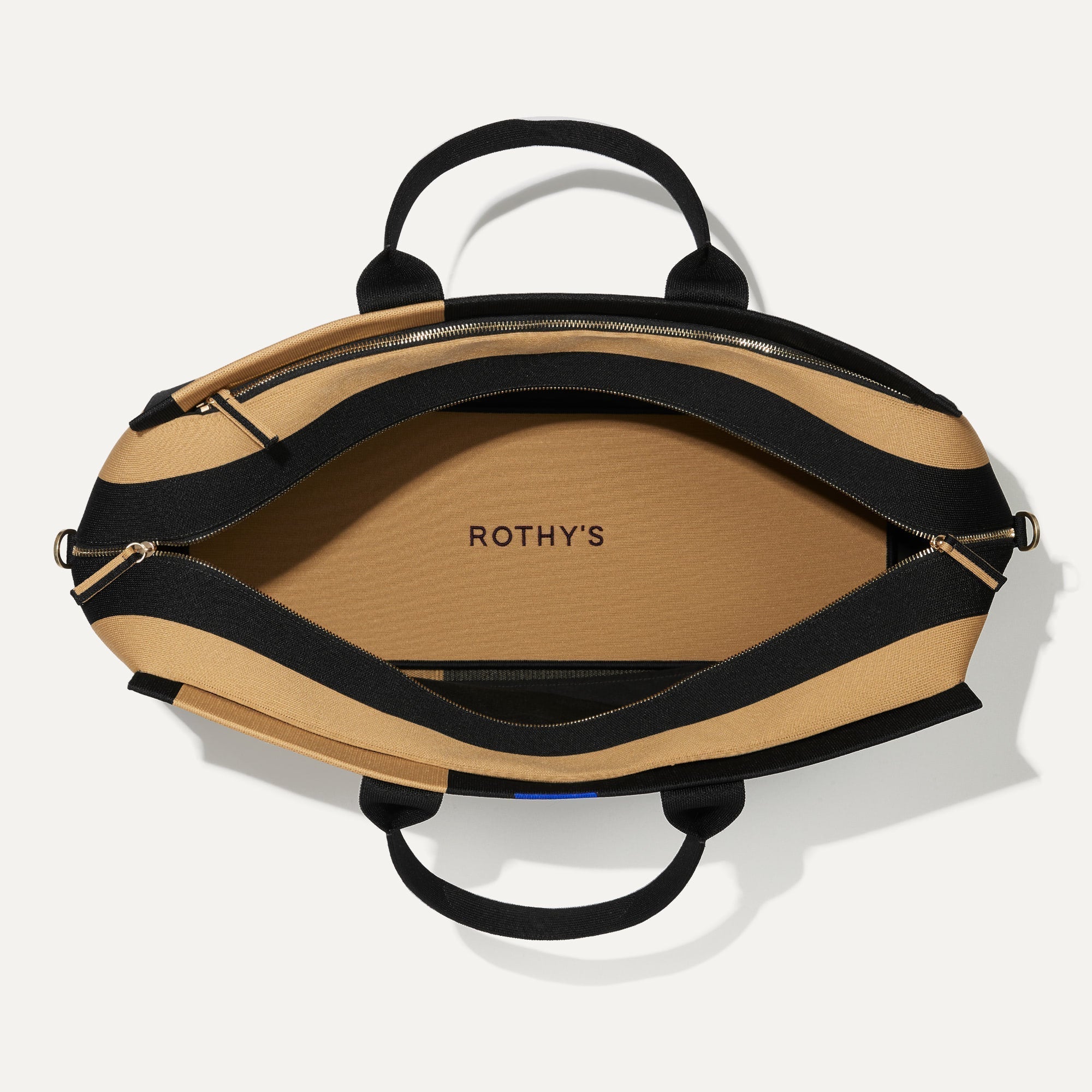 The Weekender in Camel and Black shown closed from the top.