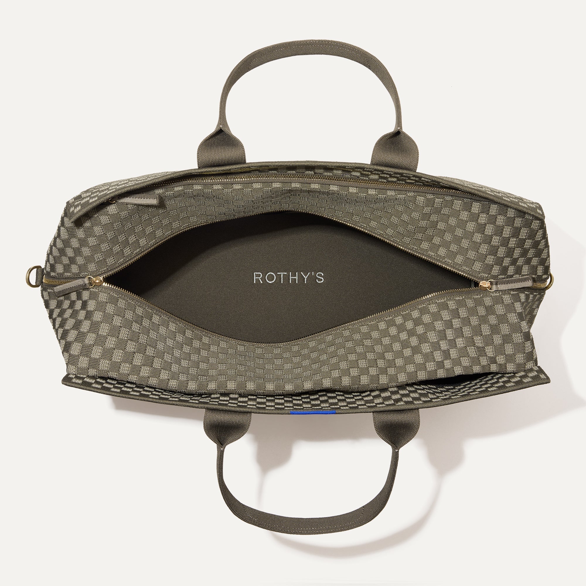 The Weekender in Safari Green shown open from the top.