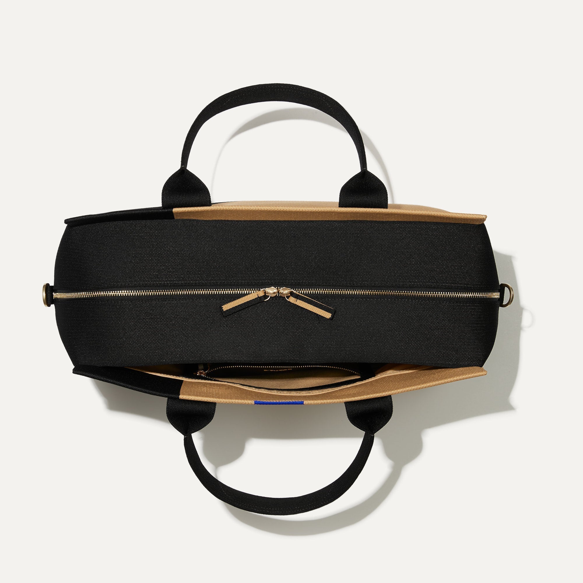 The Overnighter in Camel and Black shown closed from the top.