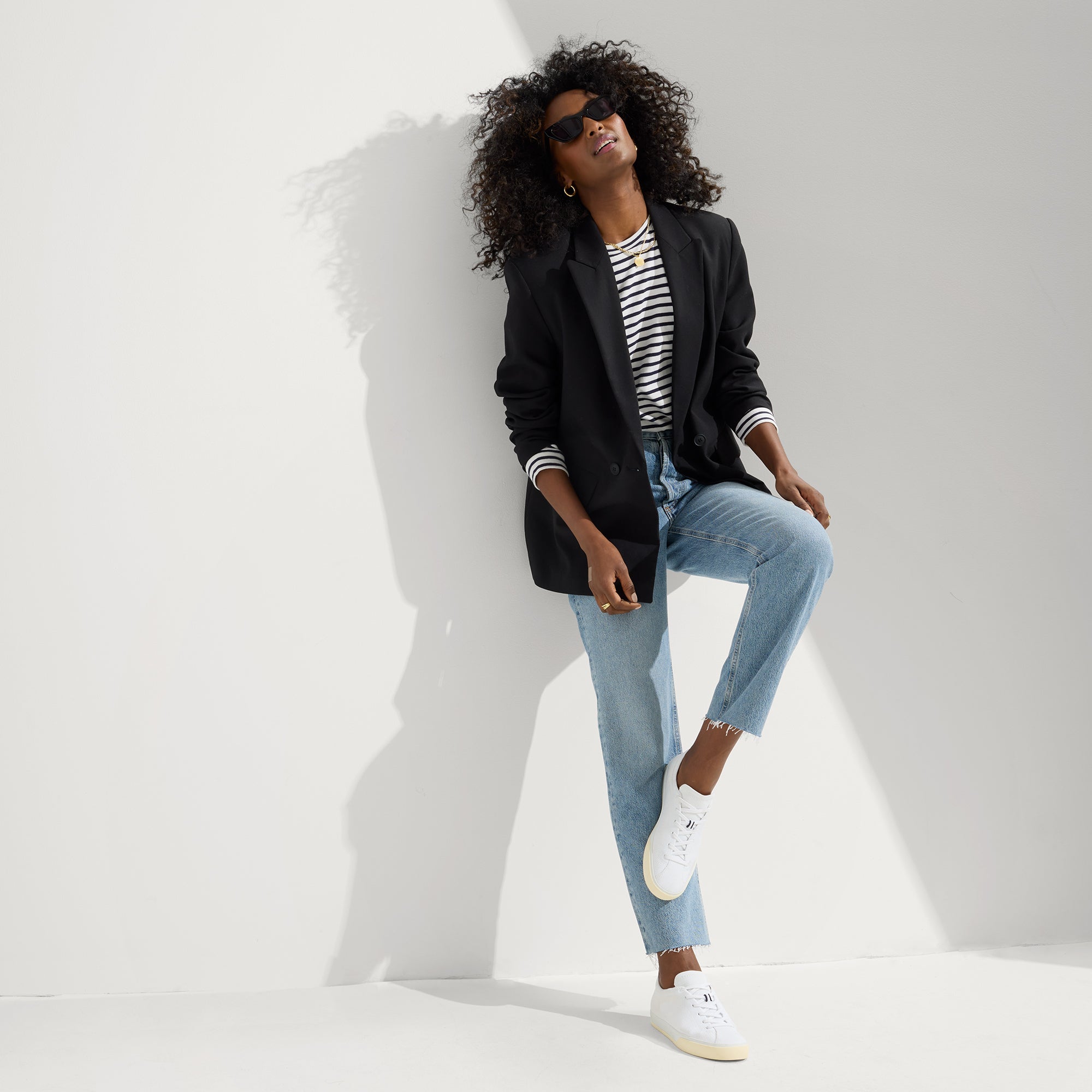 Alternate view of a model wearing The Lace Up Sneaker in Bright White.