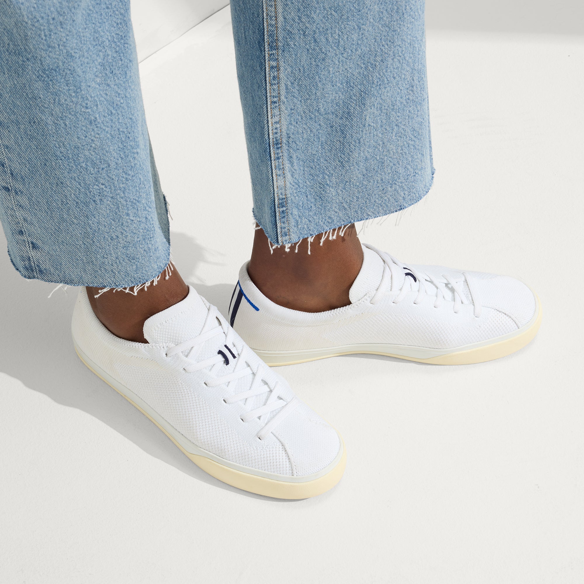 hover | Model wearing The Lace Up Sneaker in Bright White.