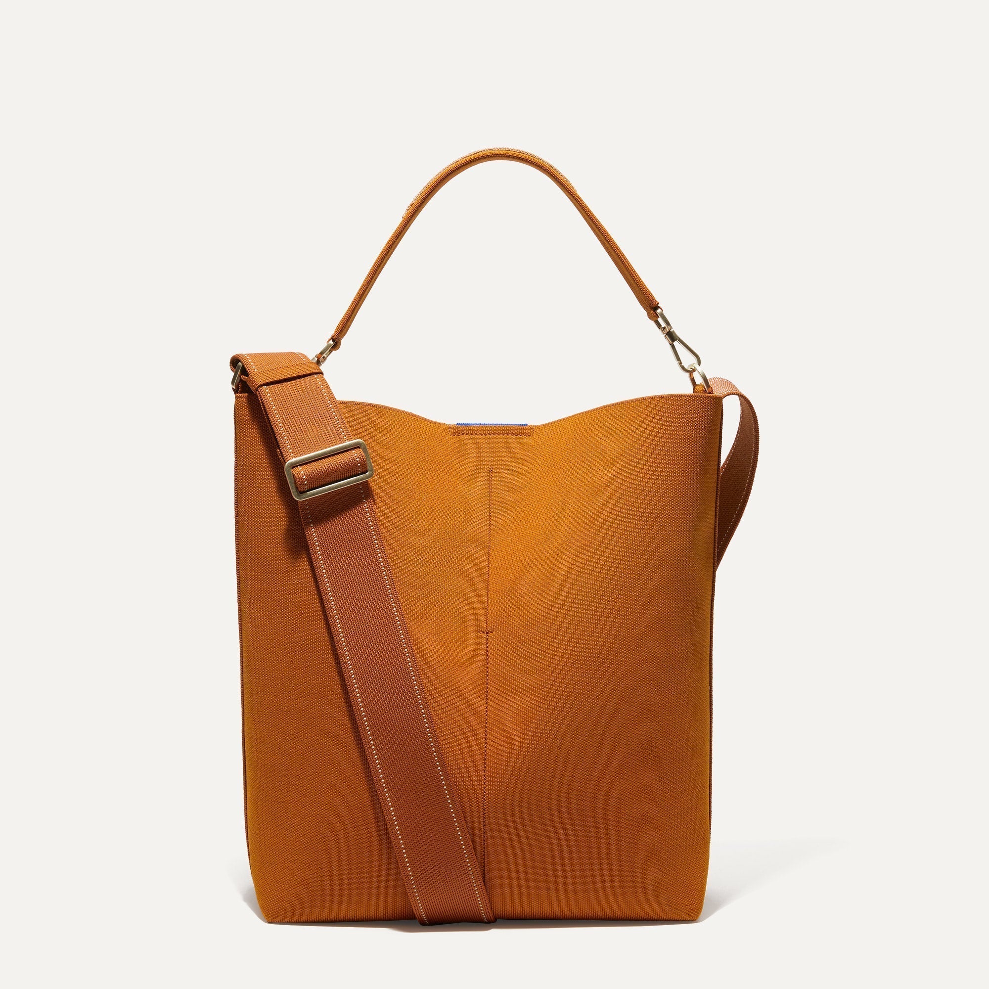 PLP |The Bucket Bag in Amber Brown shown from the front.