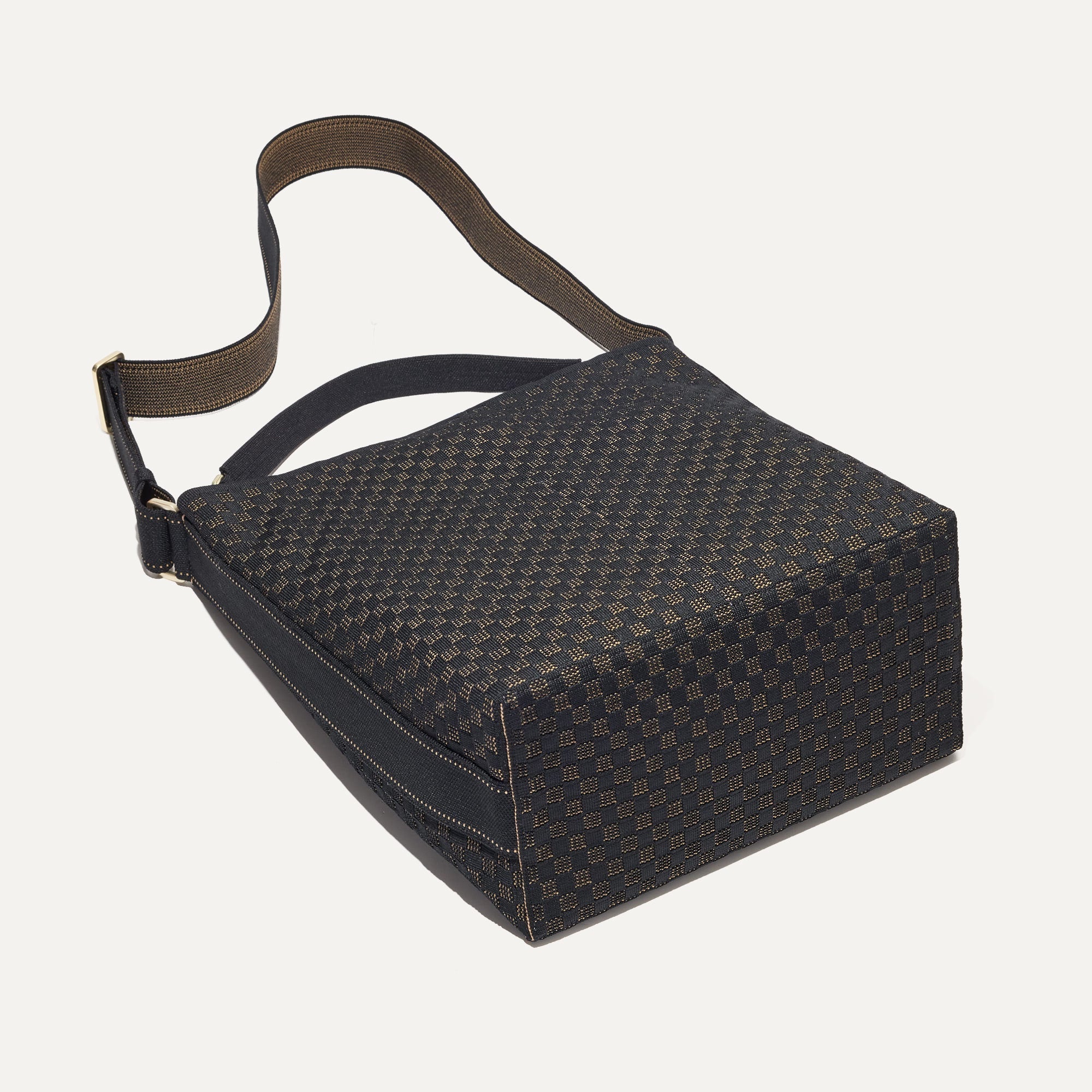 The Bucket Bag in Night Song shown laid down.