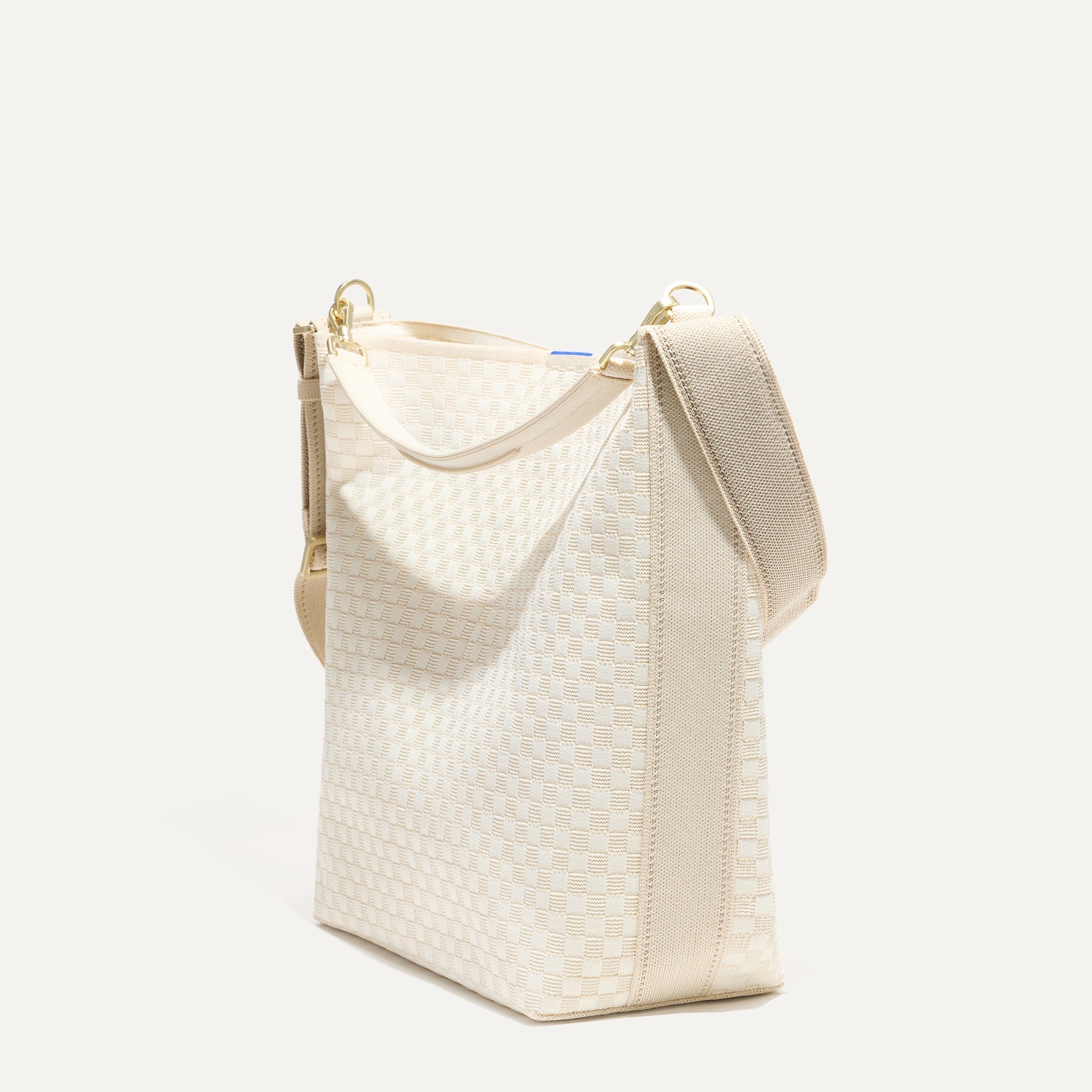 The Bucket Bag in White Sand shown in a diagonal view.