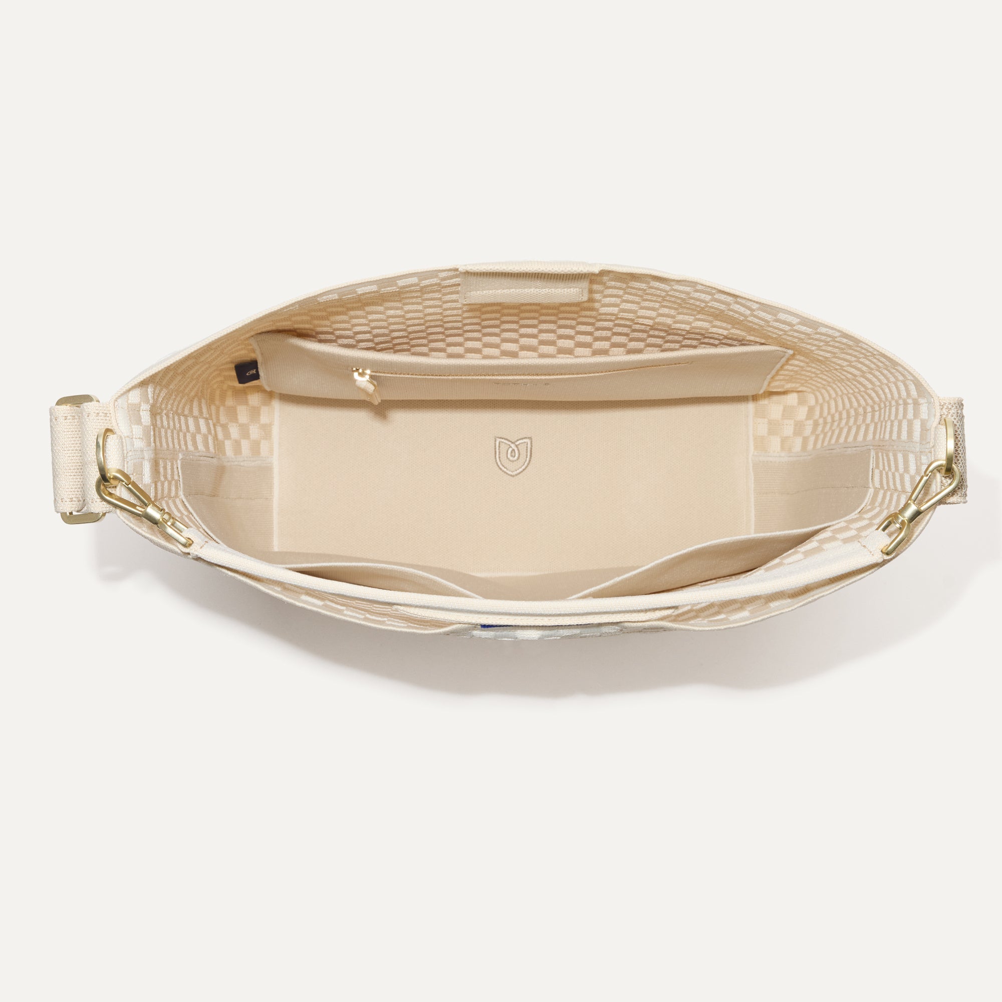 The Bucket Bag in White Sand shown from the top with base insert.