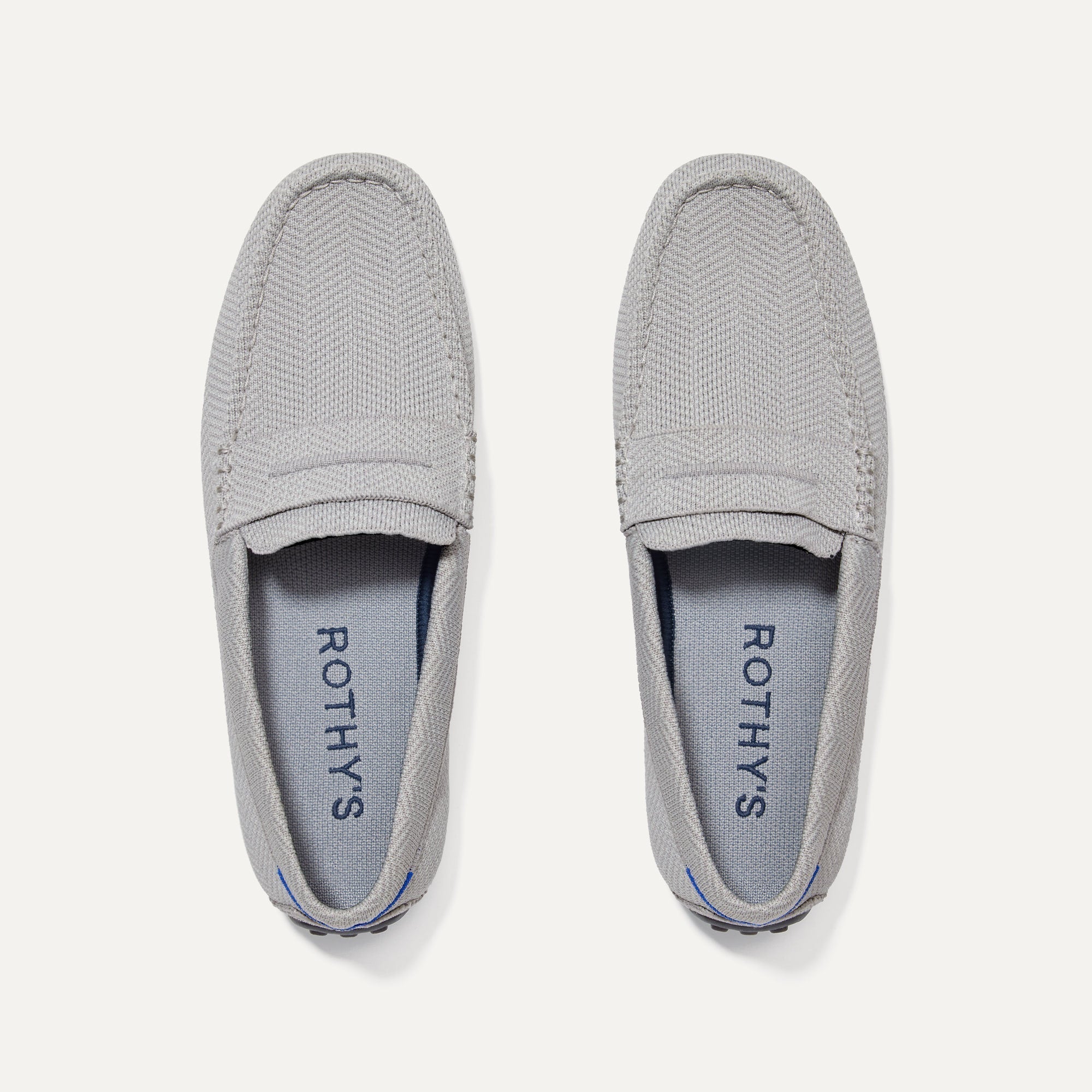 A pair of The Driving Loafer in Light Grey Herringbone shown from the top.