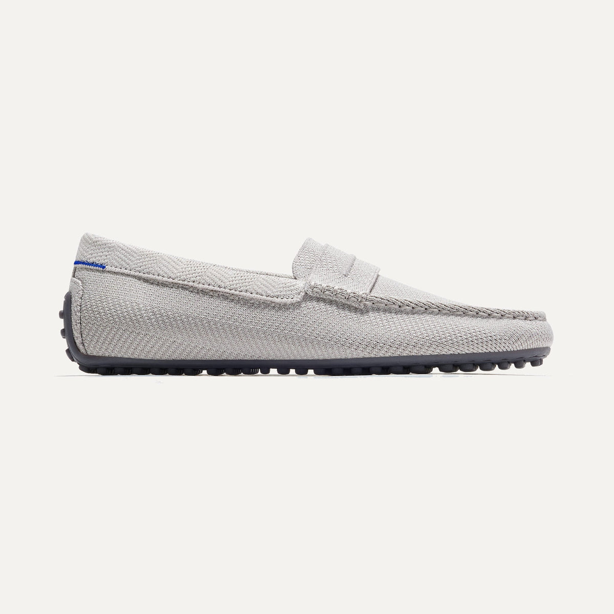 The Driving Loafer in Light Grey Herringbone shown from the side.