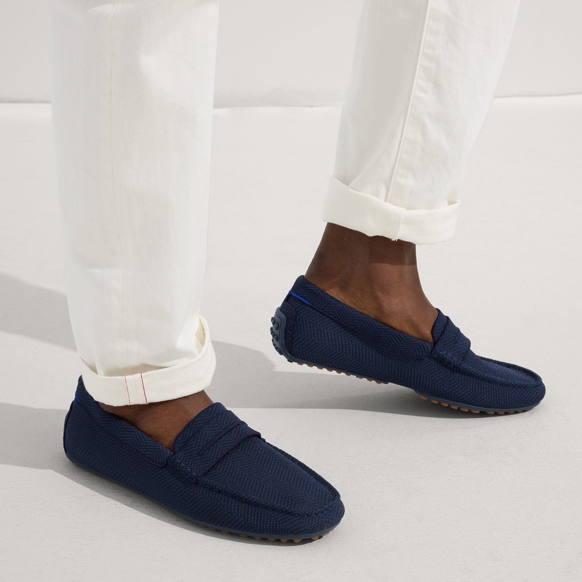 hover | Model wearing The Driving Loafer in Navy Herringbone.