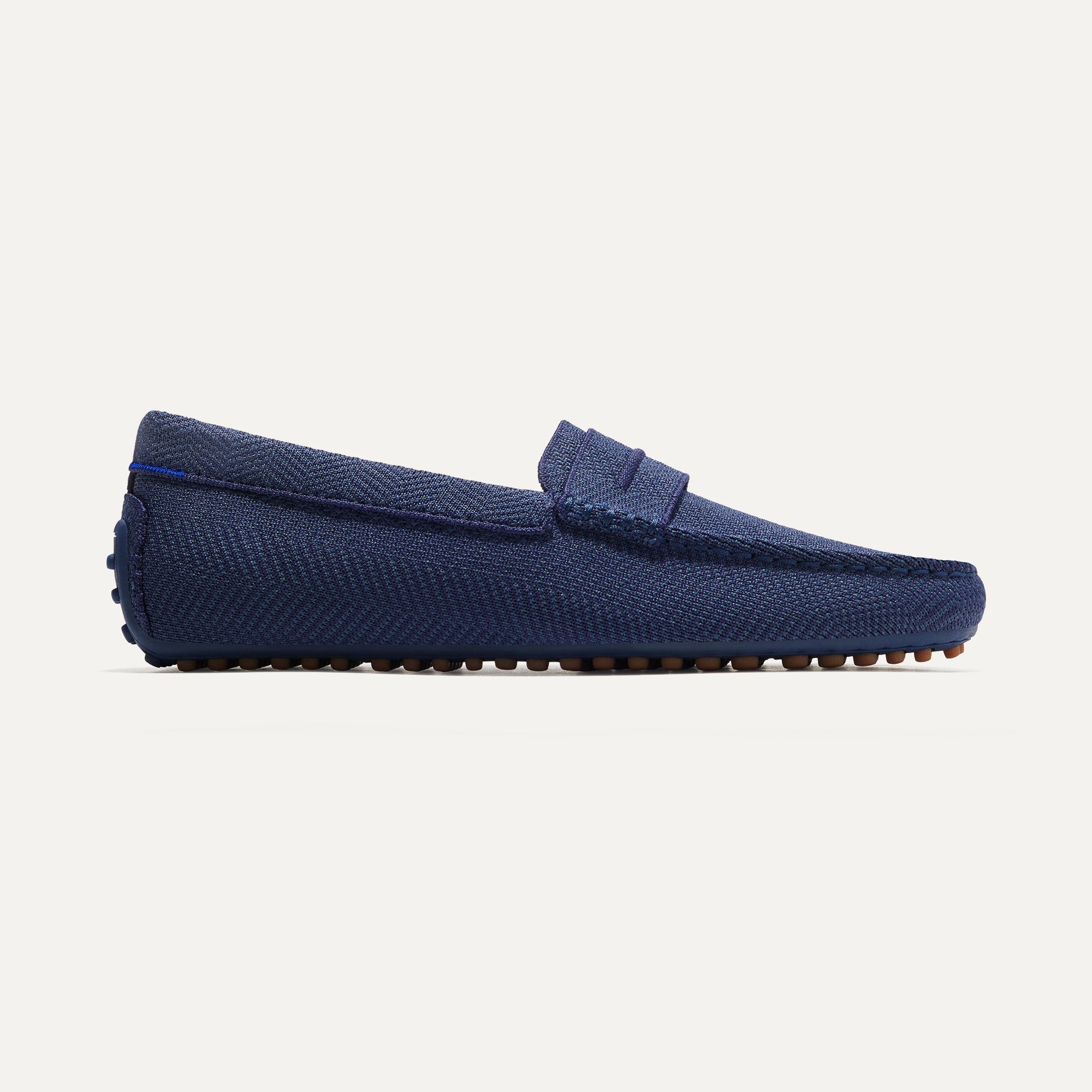The Driving Loafer in Navy Herringbone shown from the side.