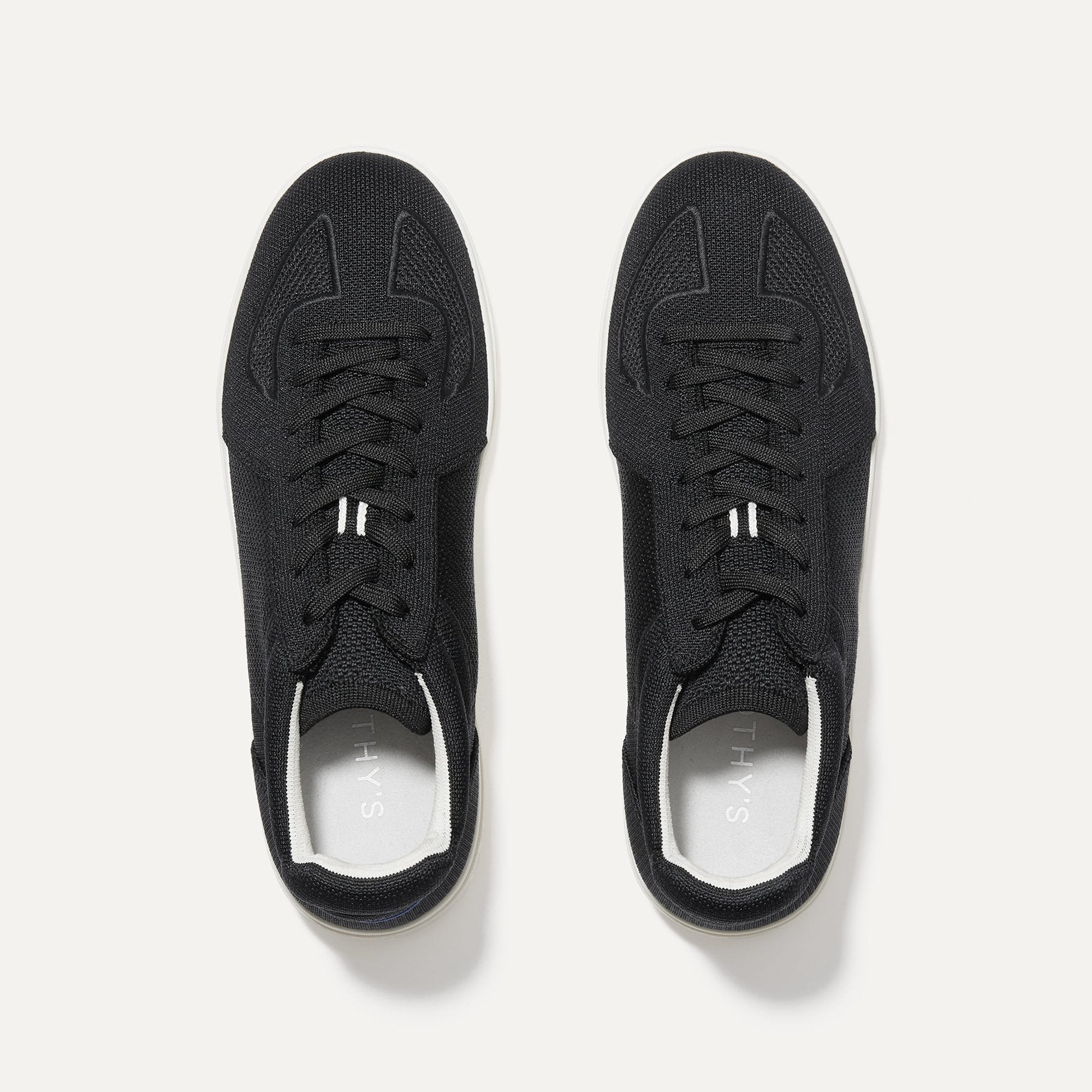 A pair of The RS01 Sneaker in Black shown from the top.