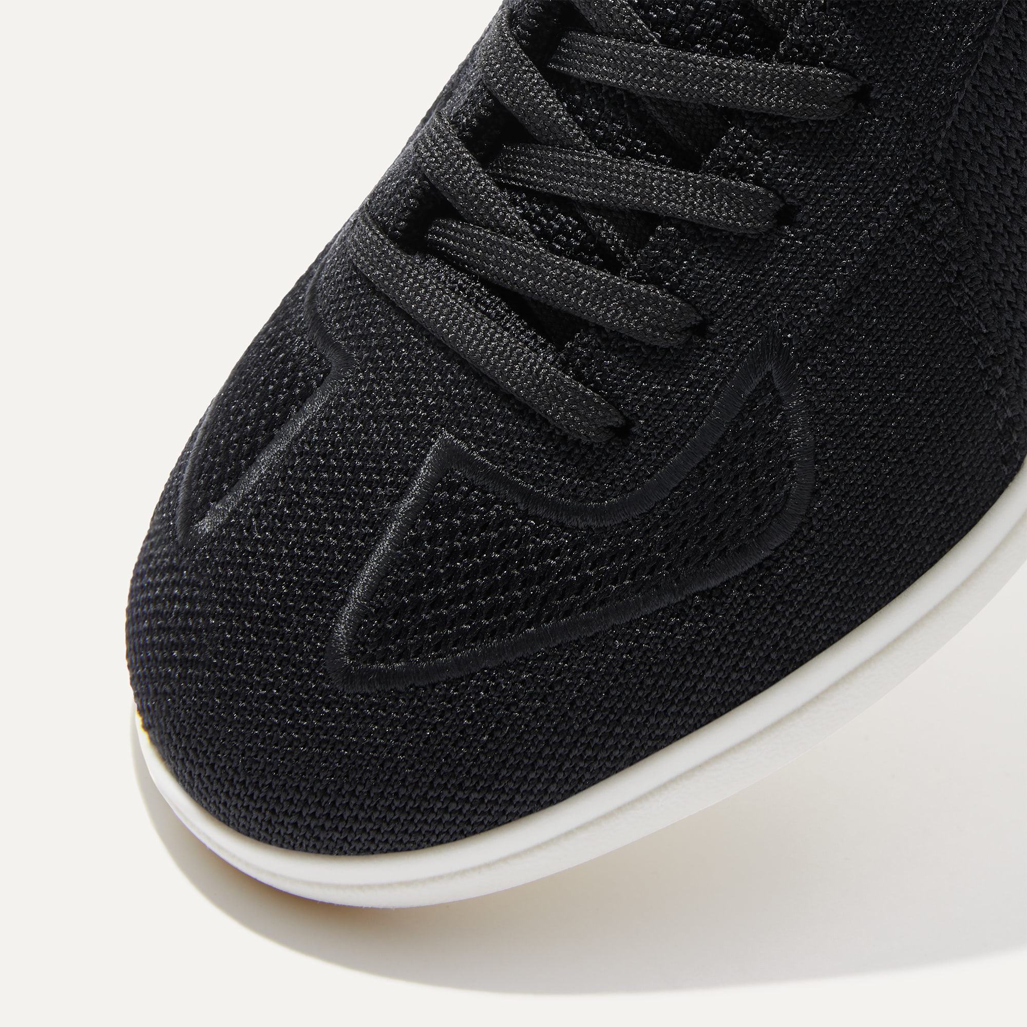 Close up of the toe and stitching details of The RS01 Sneaker in Black.