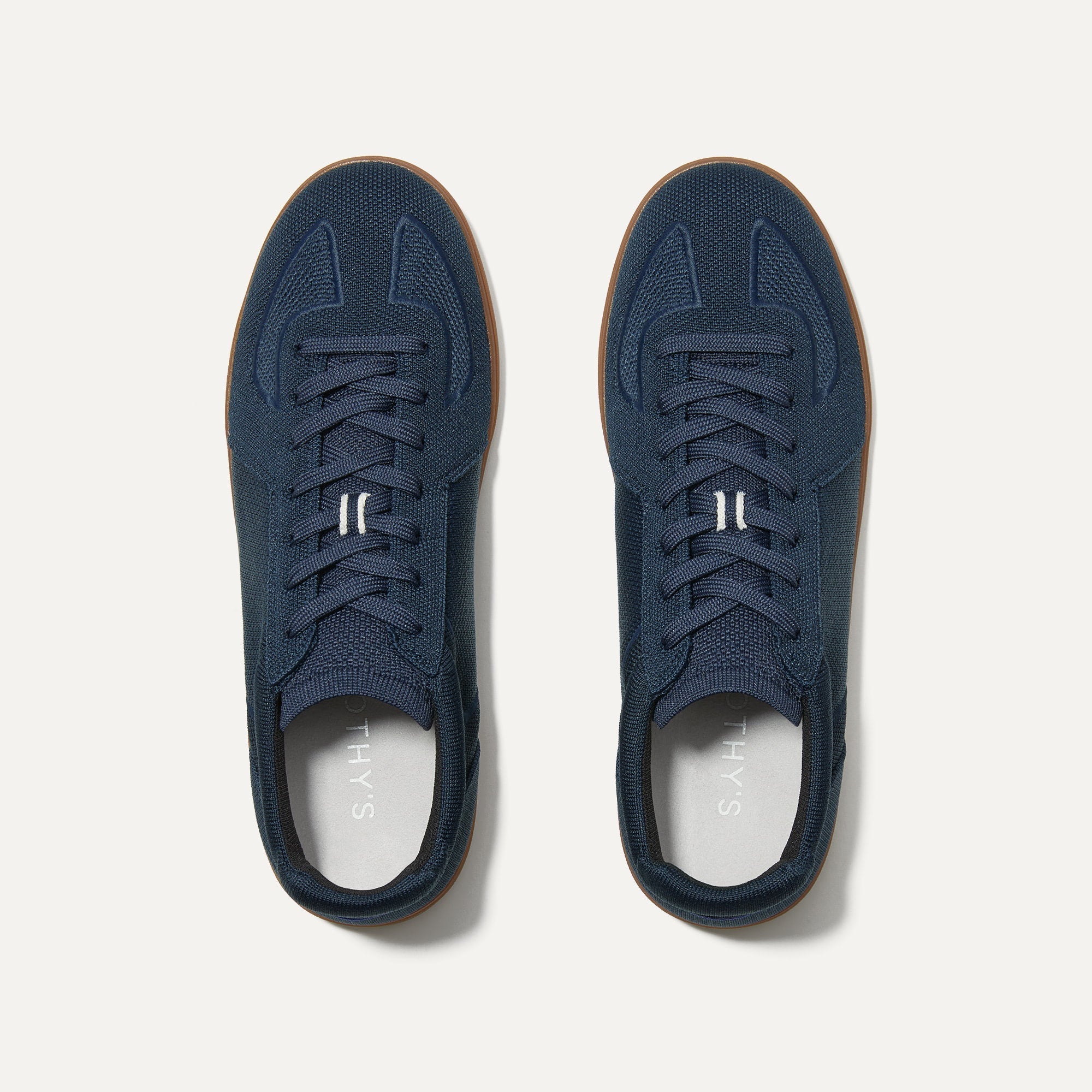 A pair of The RS01 Sneaker in Navy shown from the top.