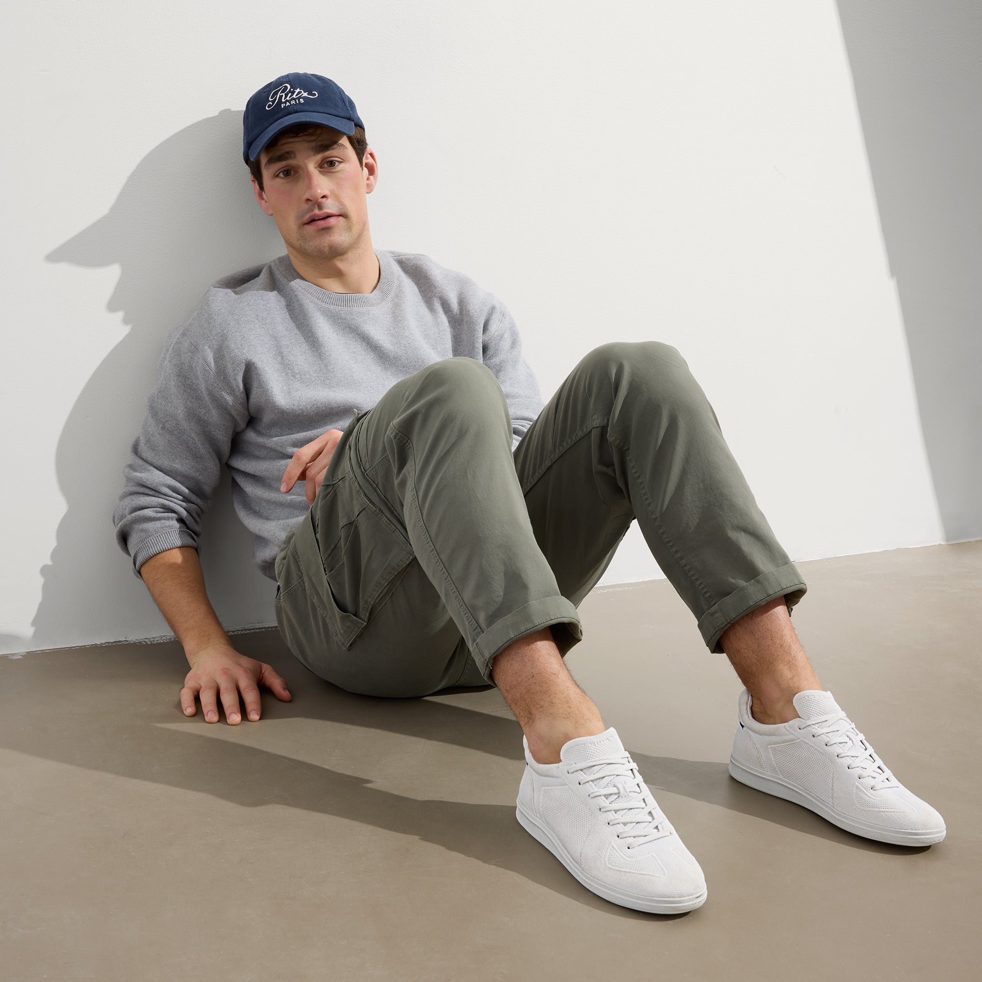 Alternate view of a model wearing The RS01 Sneaker in White.