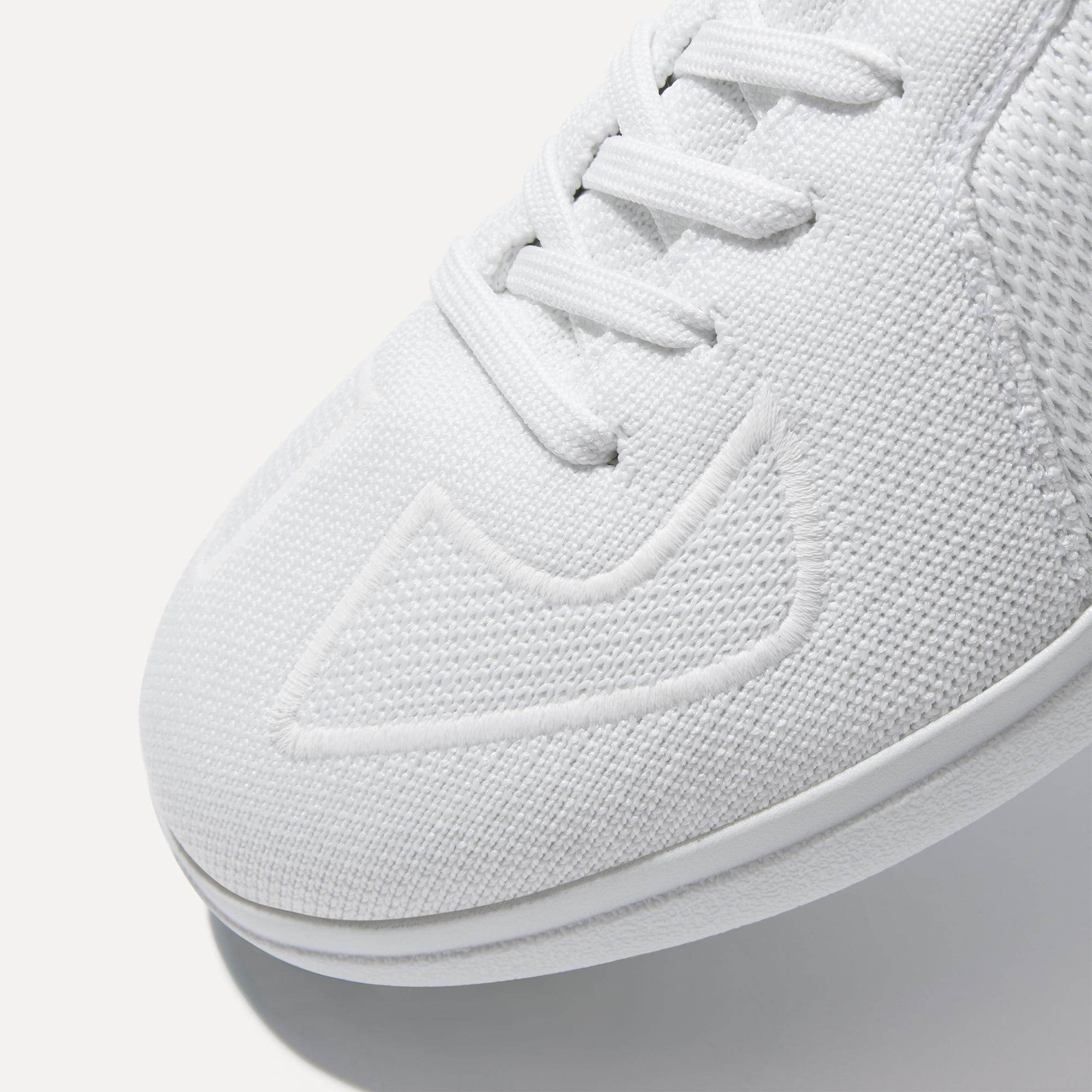 Close up of the toe and stitching details of The RS01 Sneaker in White.