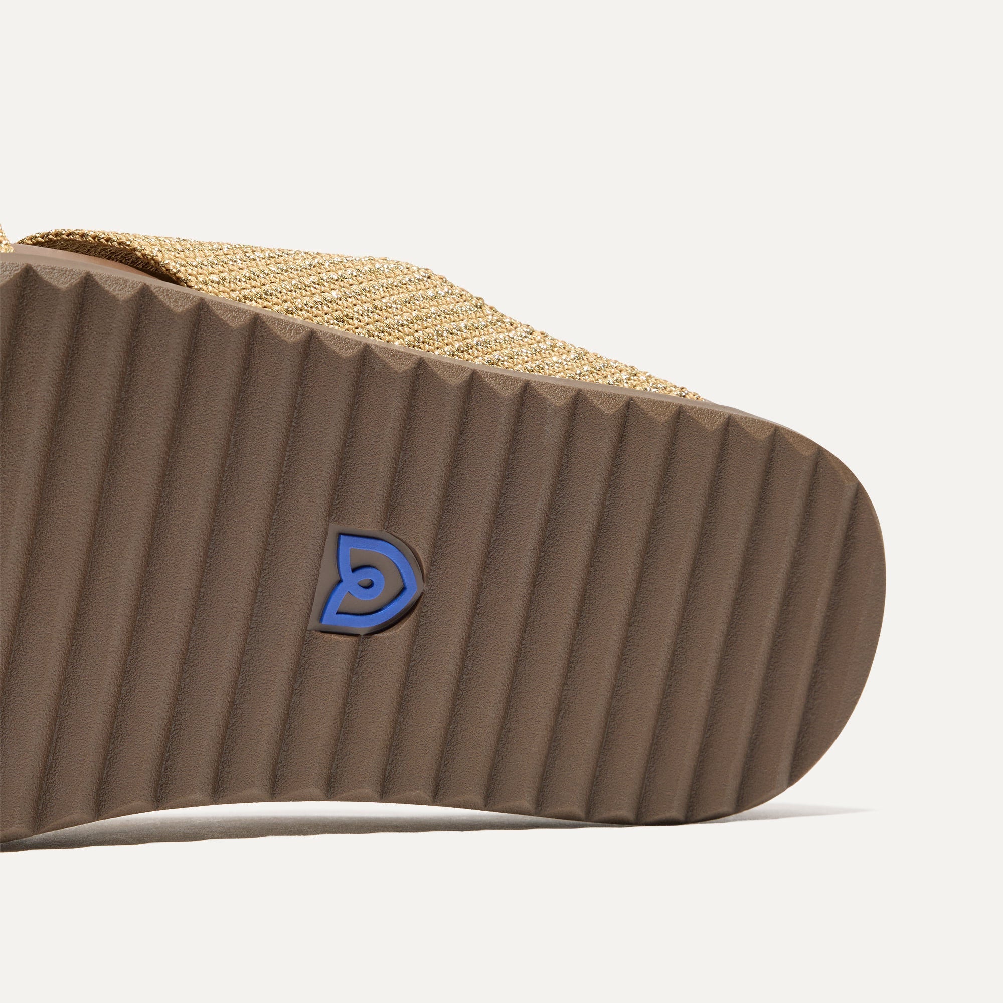 Close up of the outsole of The Weekend Slide in Golden Sun.