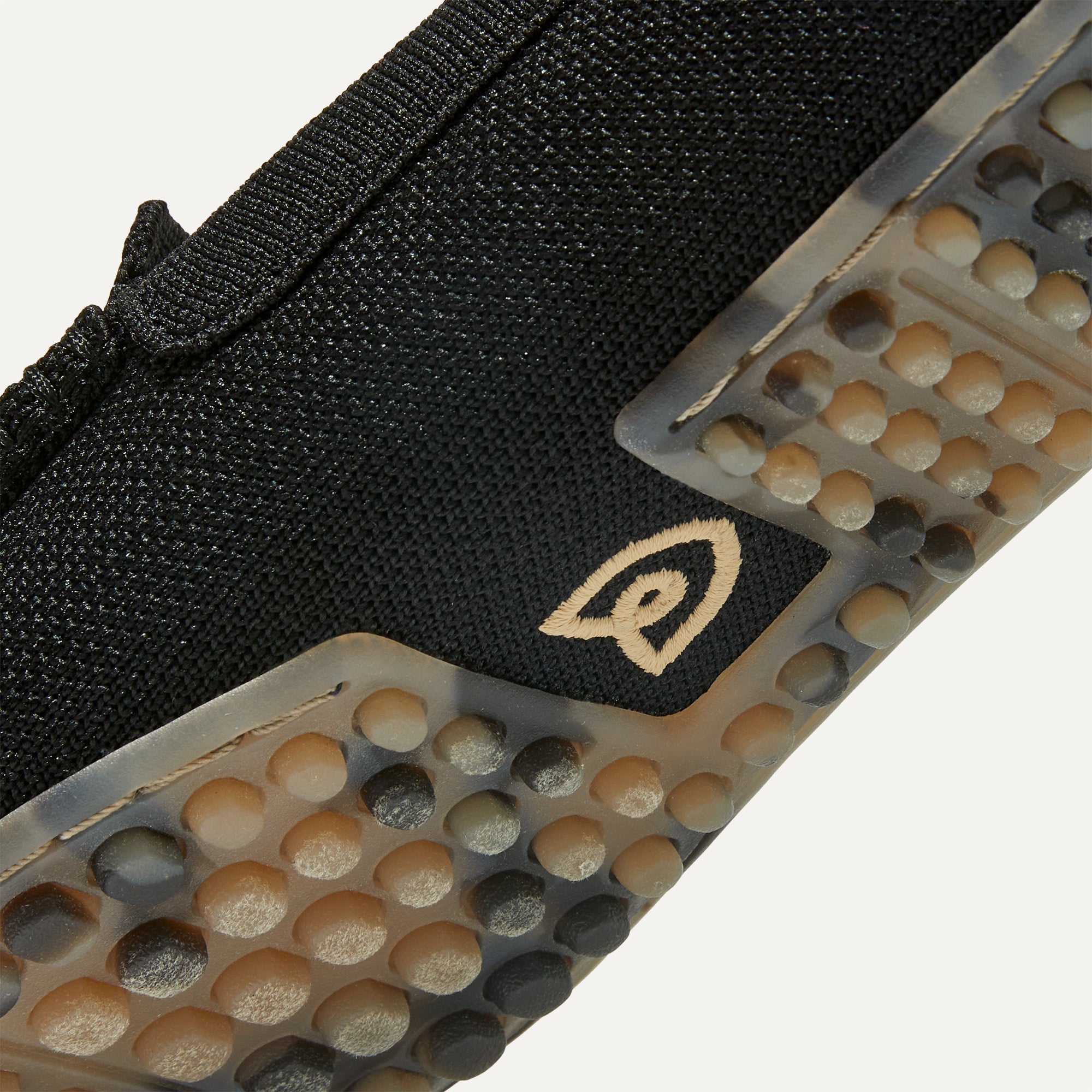Close up of the raised nub outsoles of The Driver in Black.
