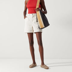 Alternate view of a model wearing The Driver in Latte.