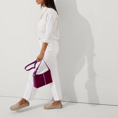 Alternate view of a model wearing The Driver in Sesame.