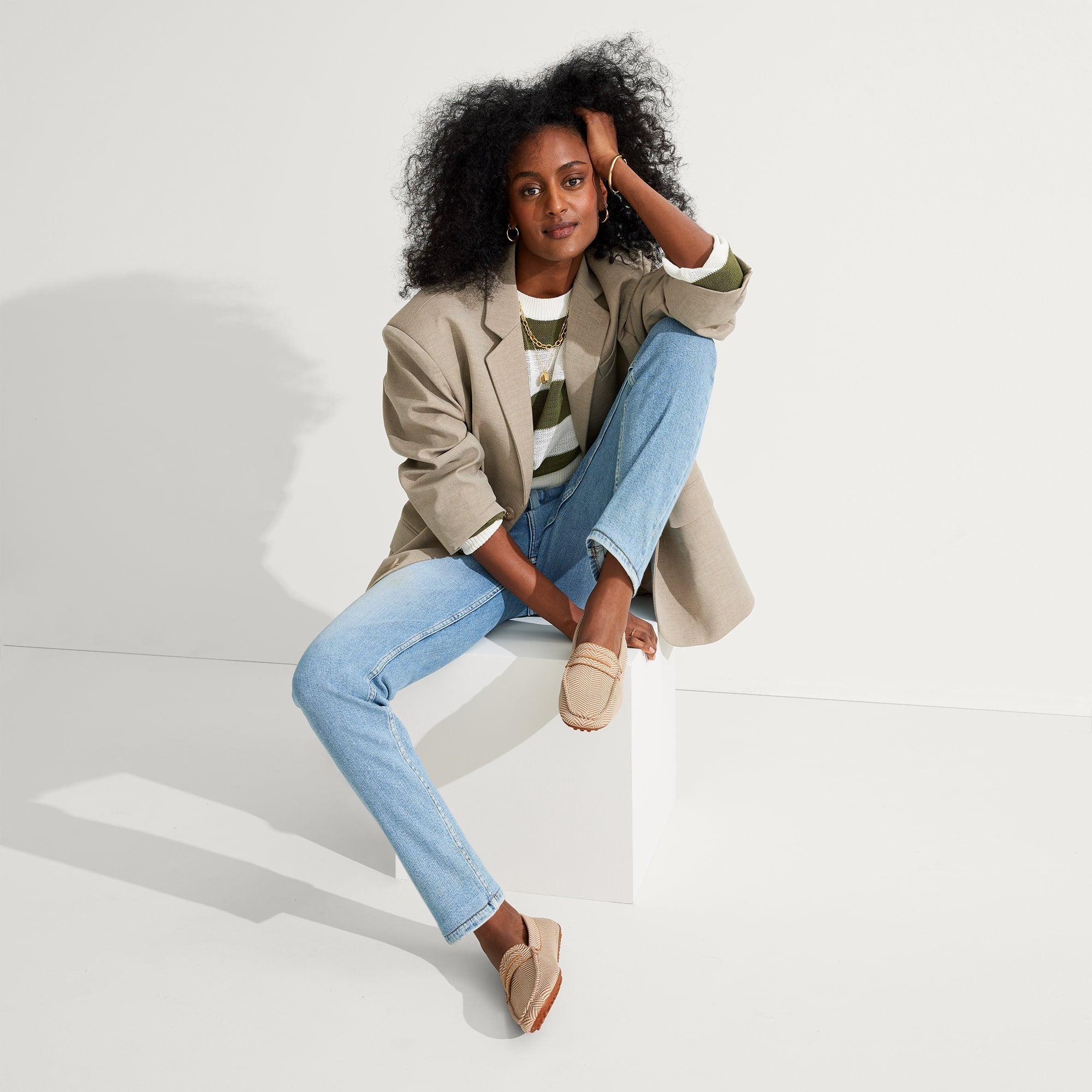 Alternate view of a model wearing The Driver in Tan Herringbone.