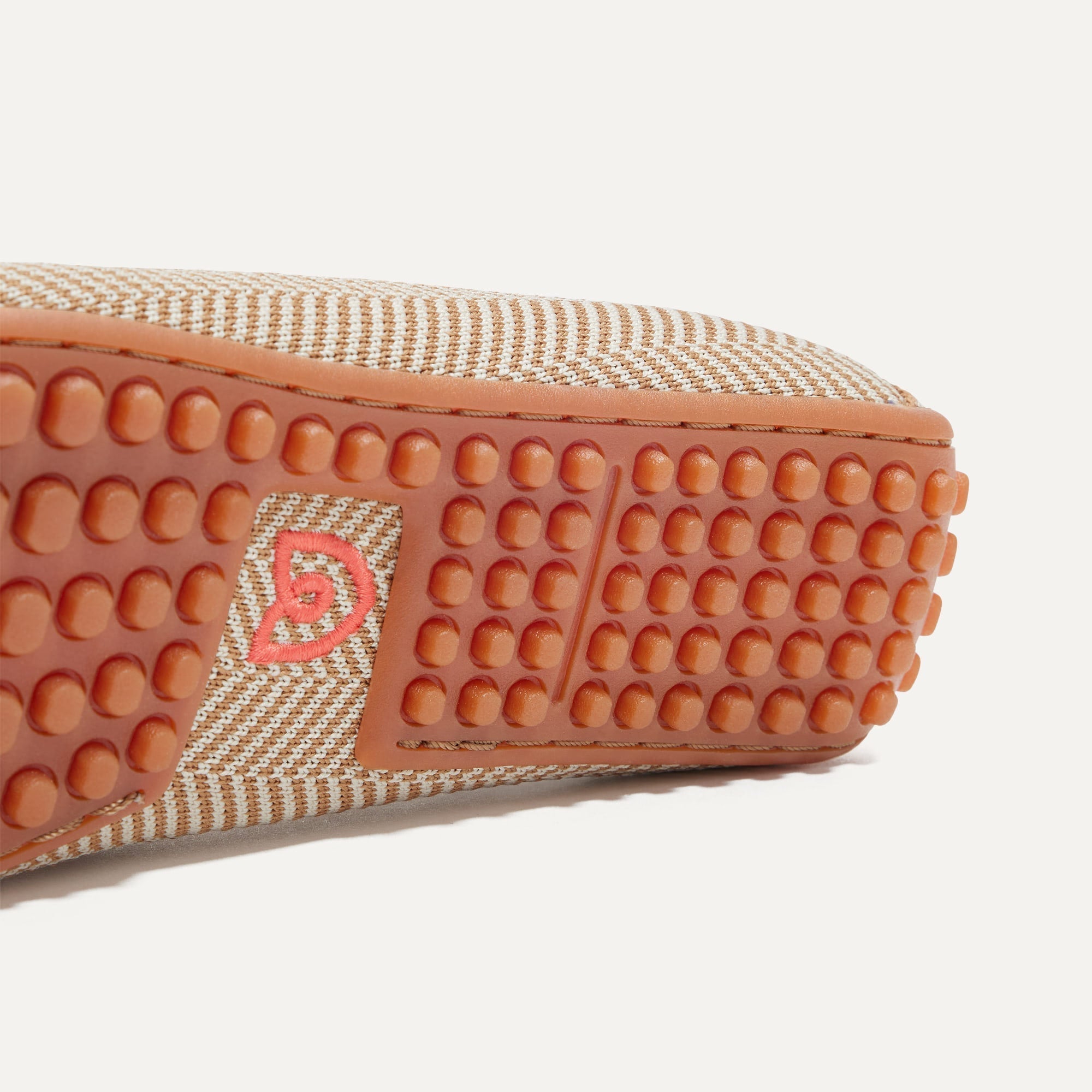 Close up of the raised nub outsoles of The Driver in Tan Herringbone.