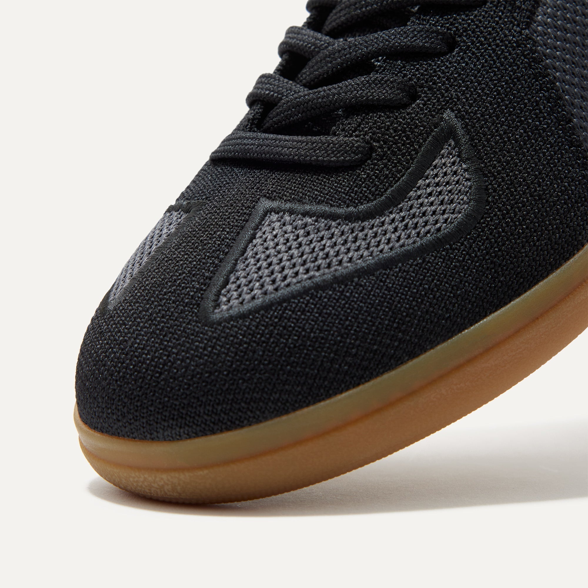 Close up of the toe and stitching details of The RS01 Sneaker in Obsidian Black.