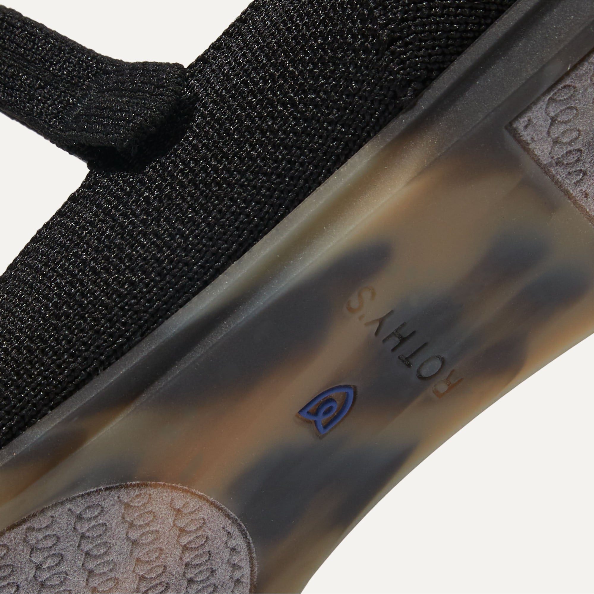 The sole of The Square Mary Jane in Black shown in diagonal view.