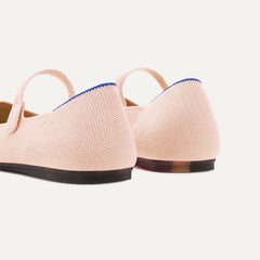 Close up of the heel of The Square Mary Jane in Bubbly Pink, with Rothy's signature blue halo. 