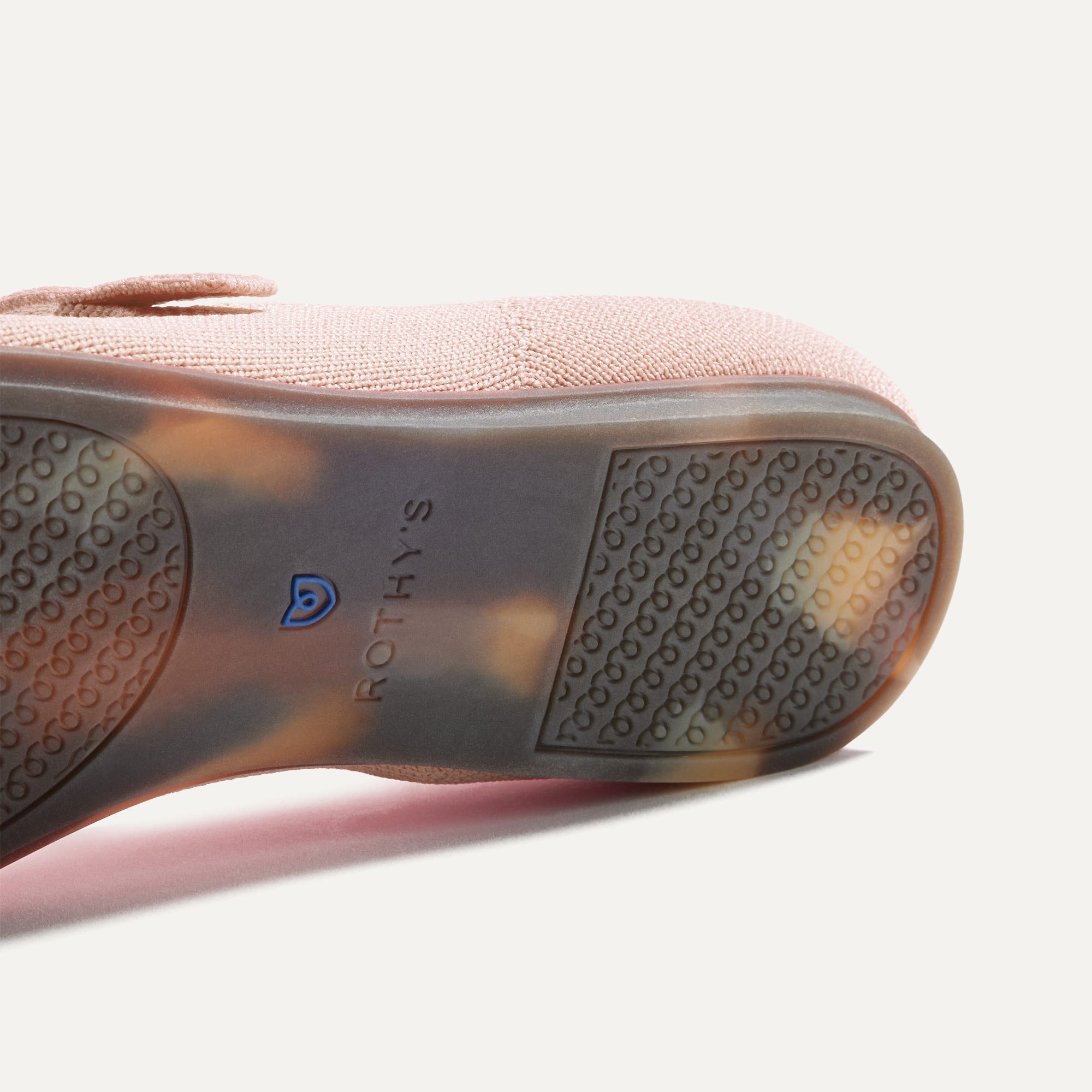 The sole of The Square Mary Jane in Bubbly Pink shown in diagonal view.